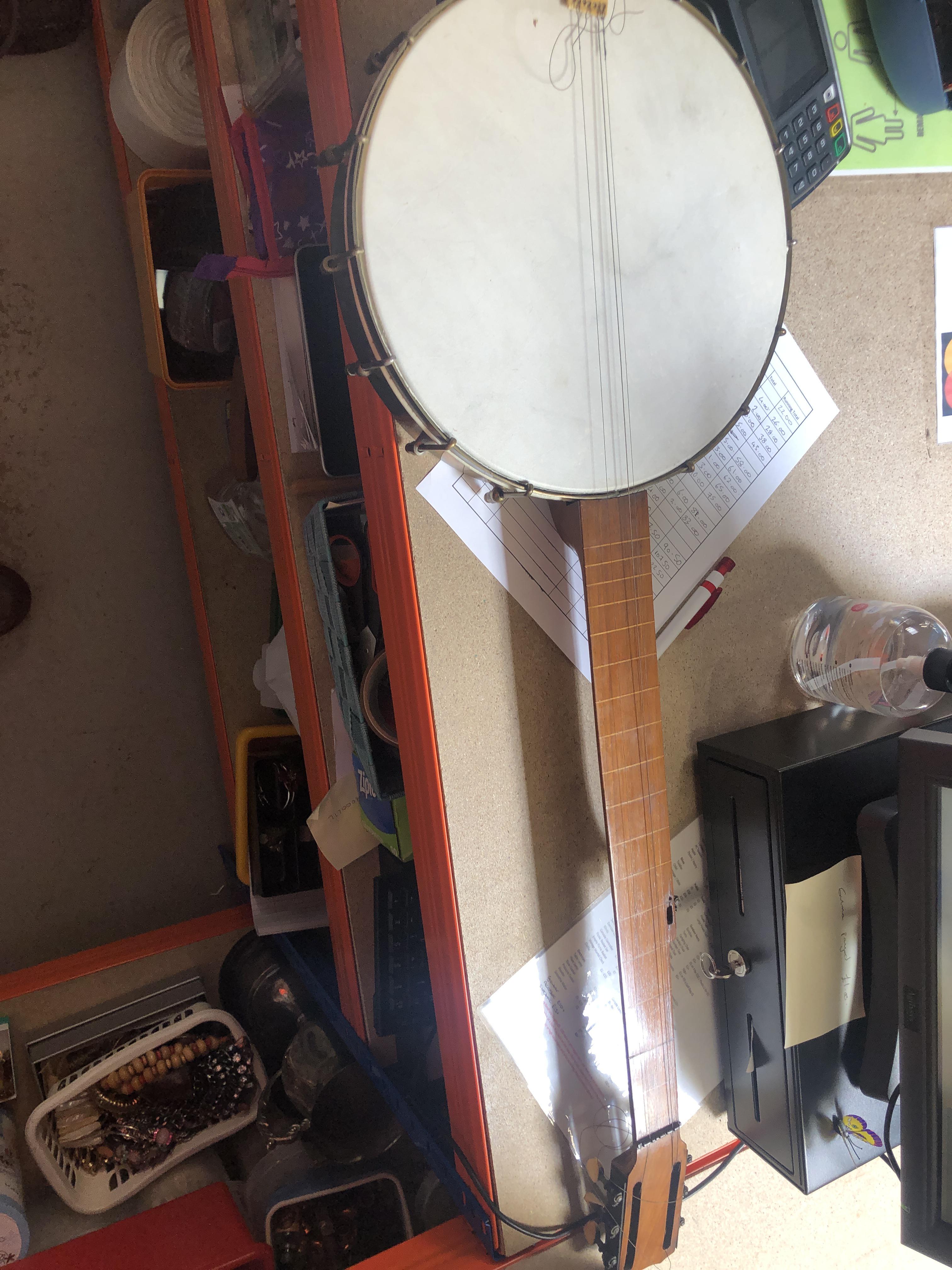 Can anyone help in identifying/valuing this banjo? I work in a charity