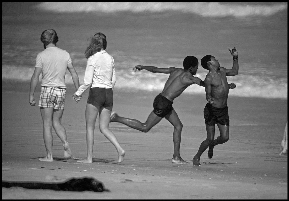 Black Africans on a legally whitesonly beach, Muizenberg, South Africa