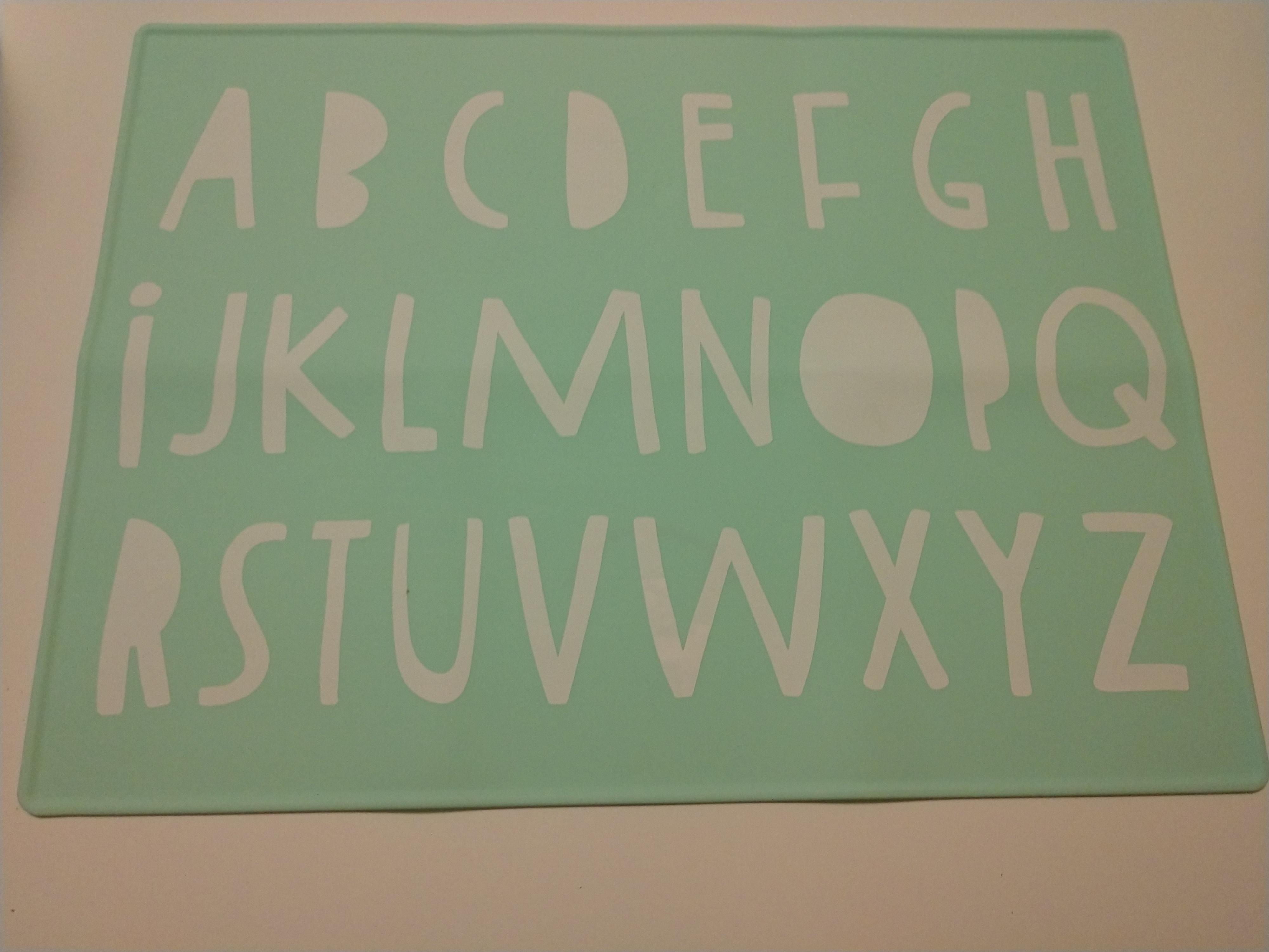 Every letter but the I is uppercase on this alphabet place mat r