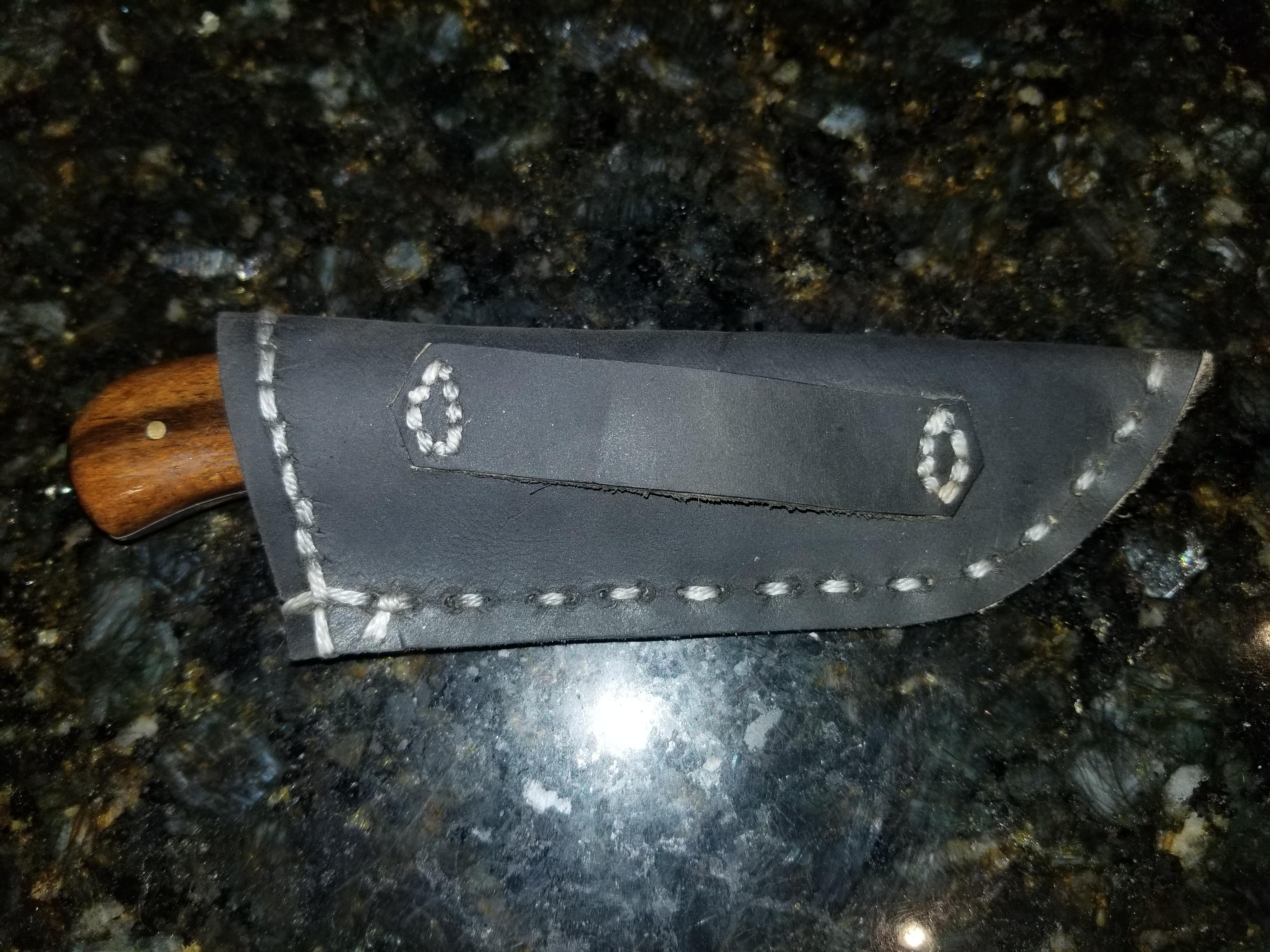 My attempt at a knife sheath. Any thoughts or critiques are