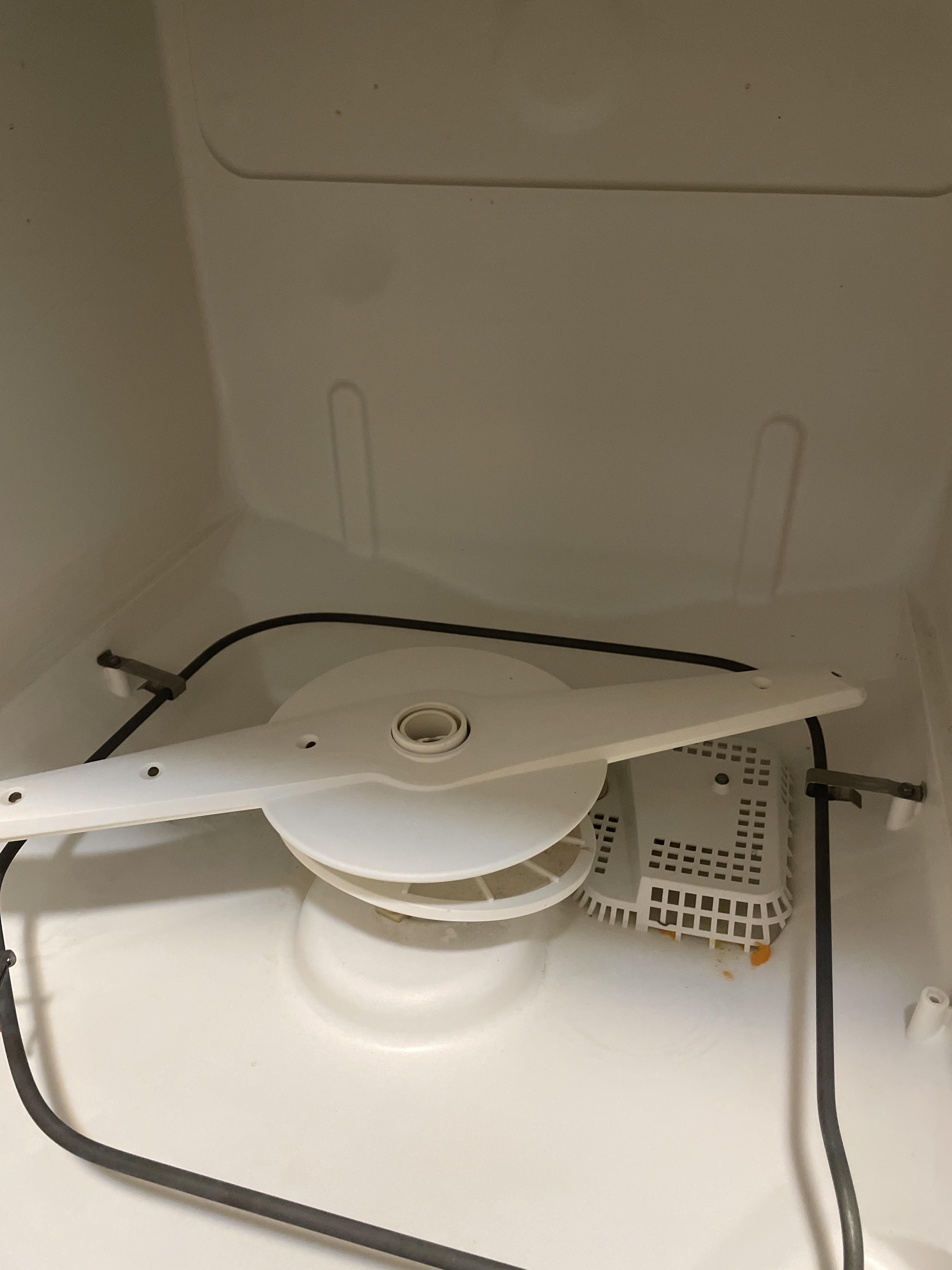 Dishes smell fishy after cleaning, how do I clean out the filter or fix