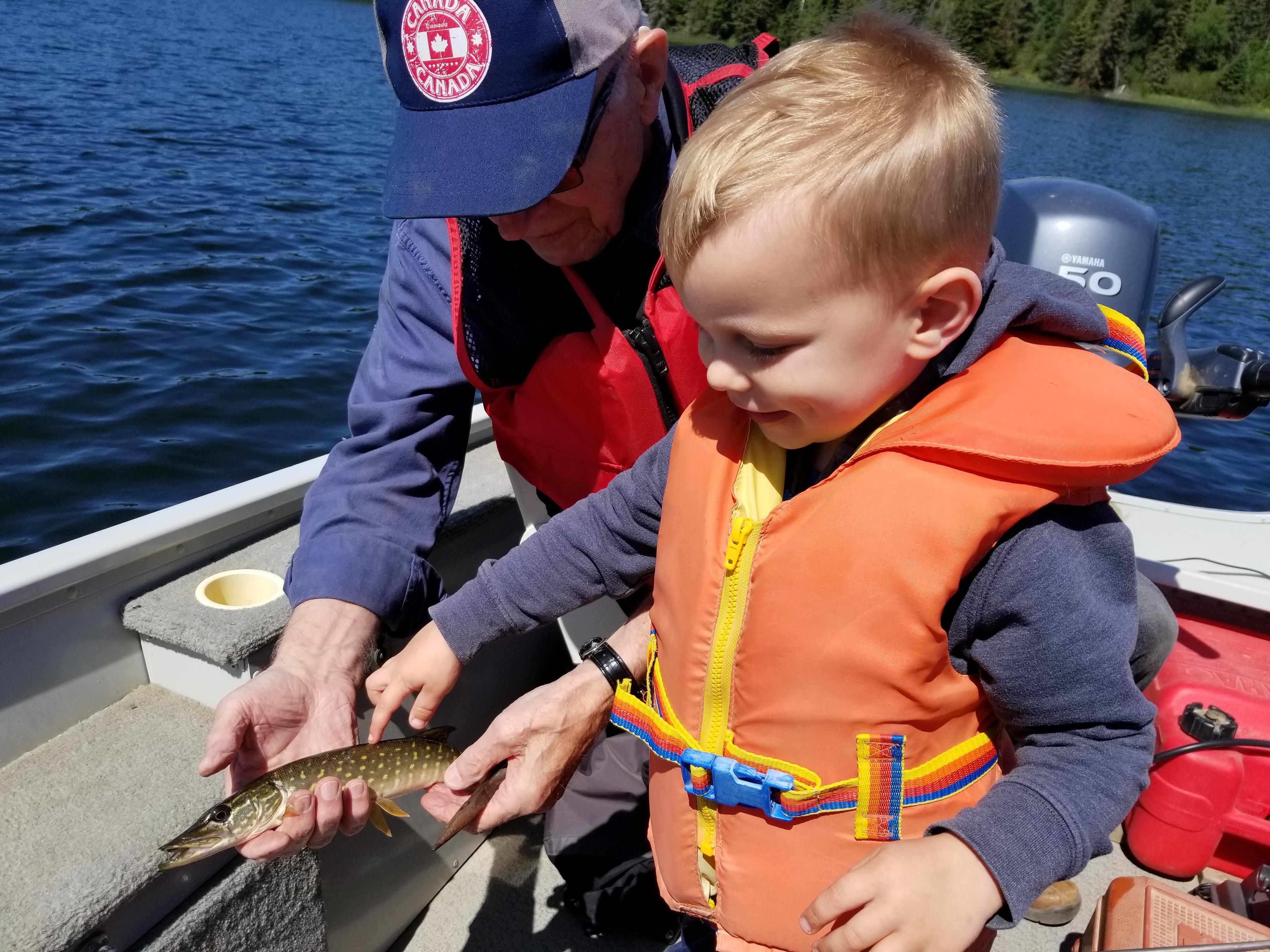 My 4 yr old, Tristan, caught his 1st fish with his greatgrandfather