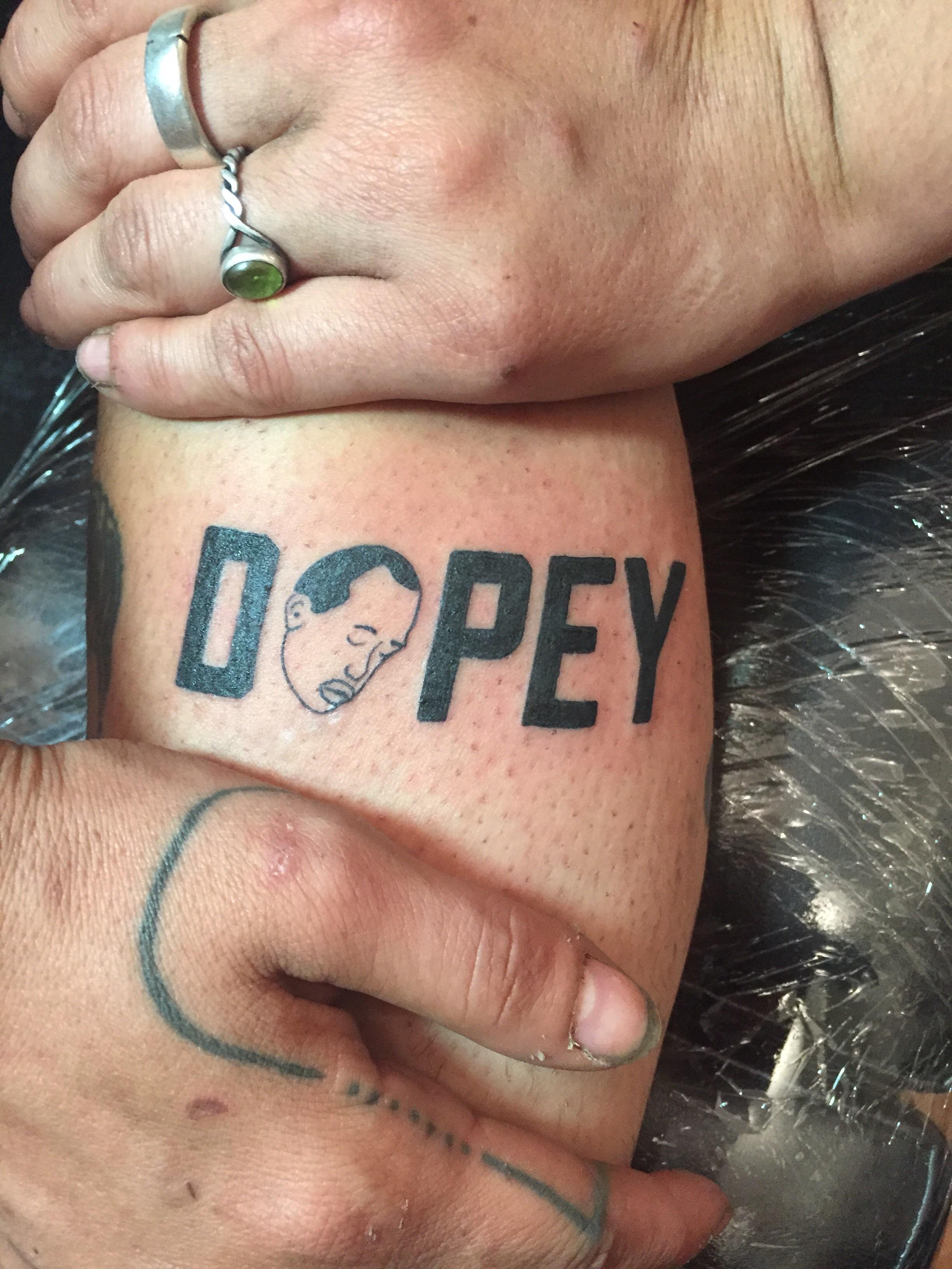 Dopey Tattoo! Someone likes our stupid podcast enough to put it on