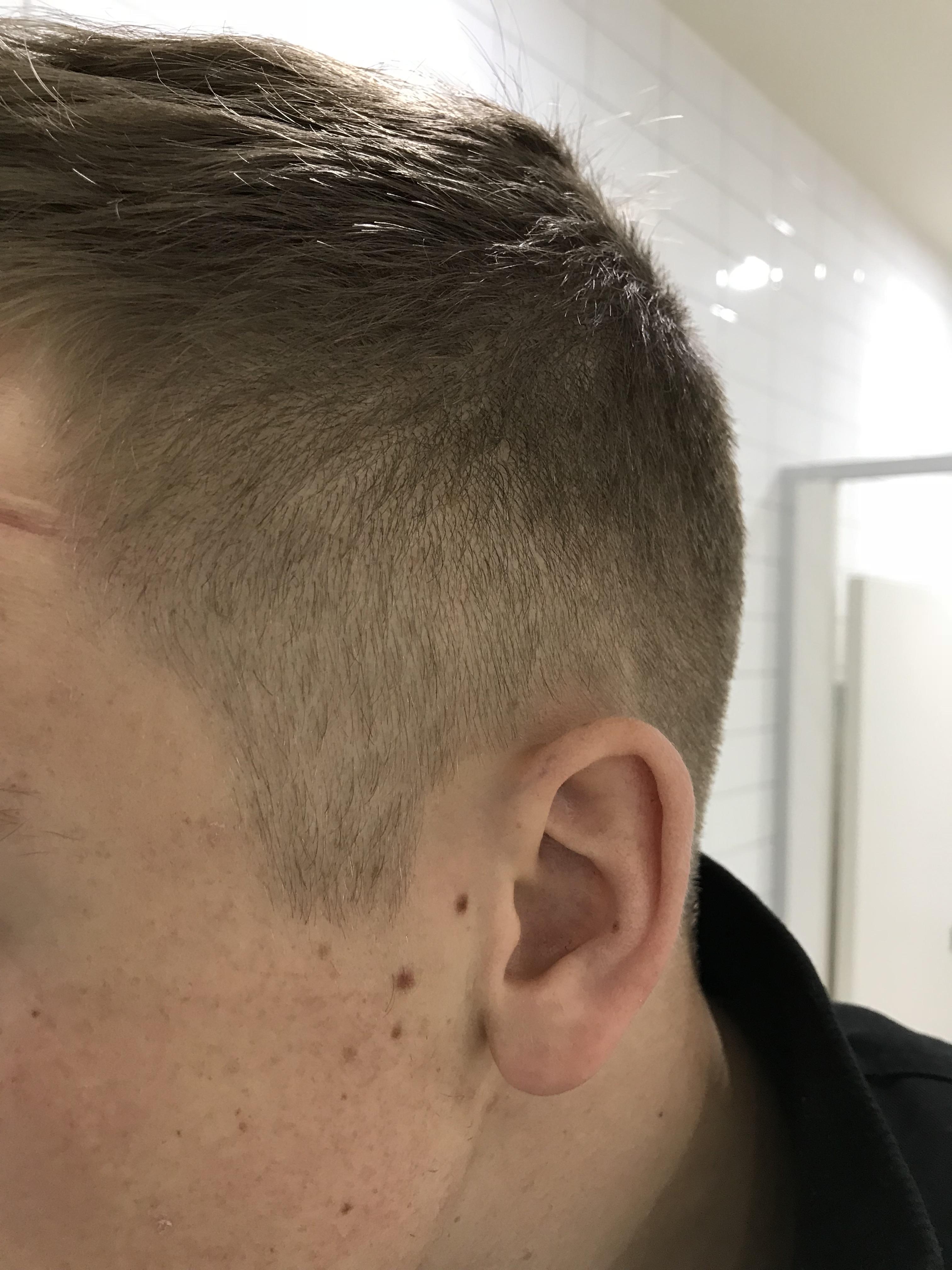 How do I get my hair to stay flat and smooth like this without wearing a hat for half the day