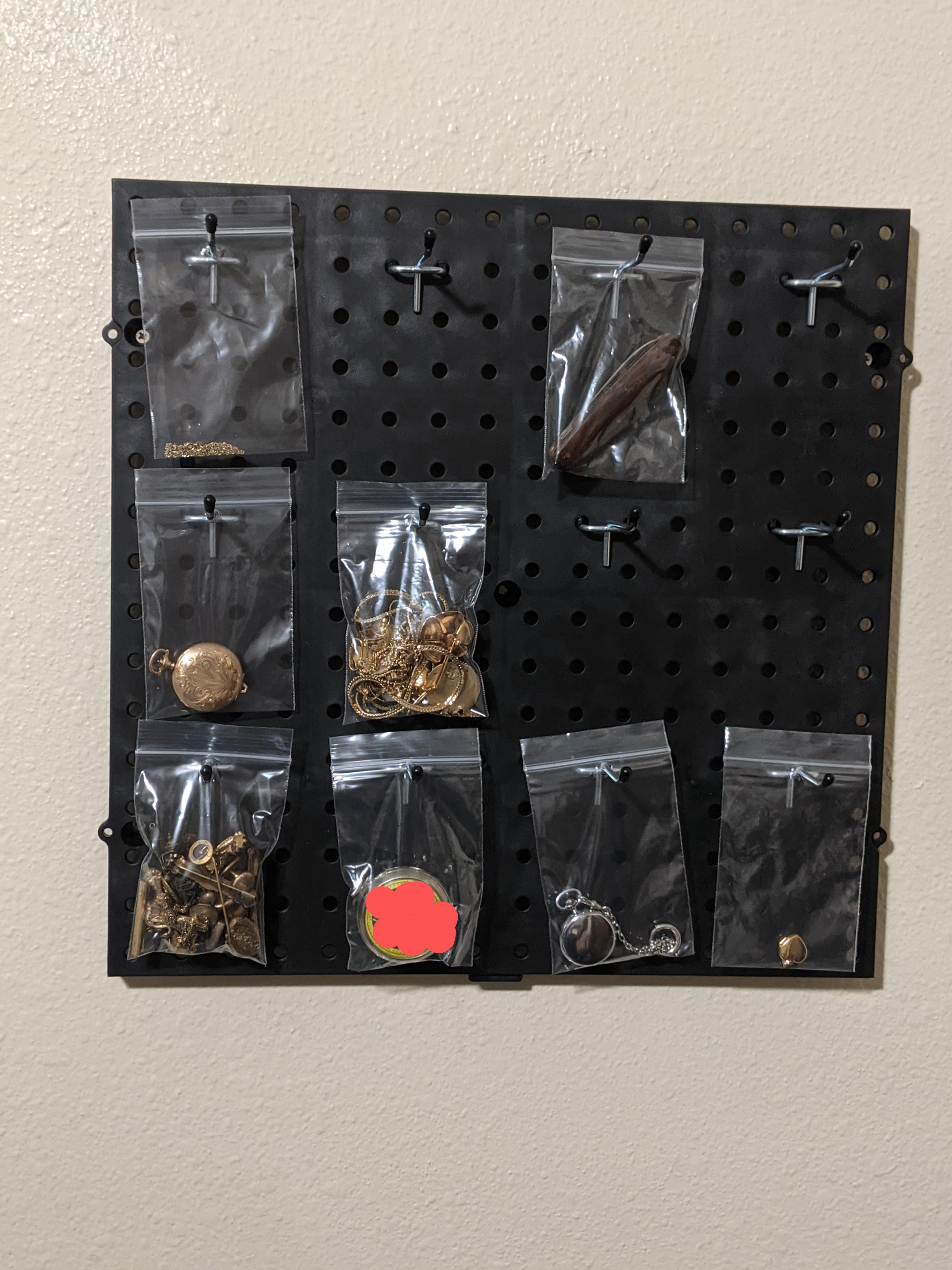 7 plastic pegboard at home Depot and some hooks= a great way to