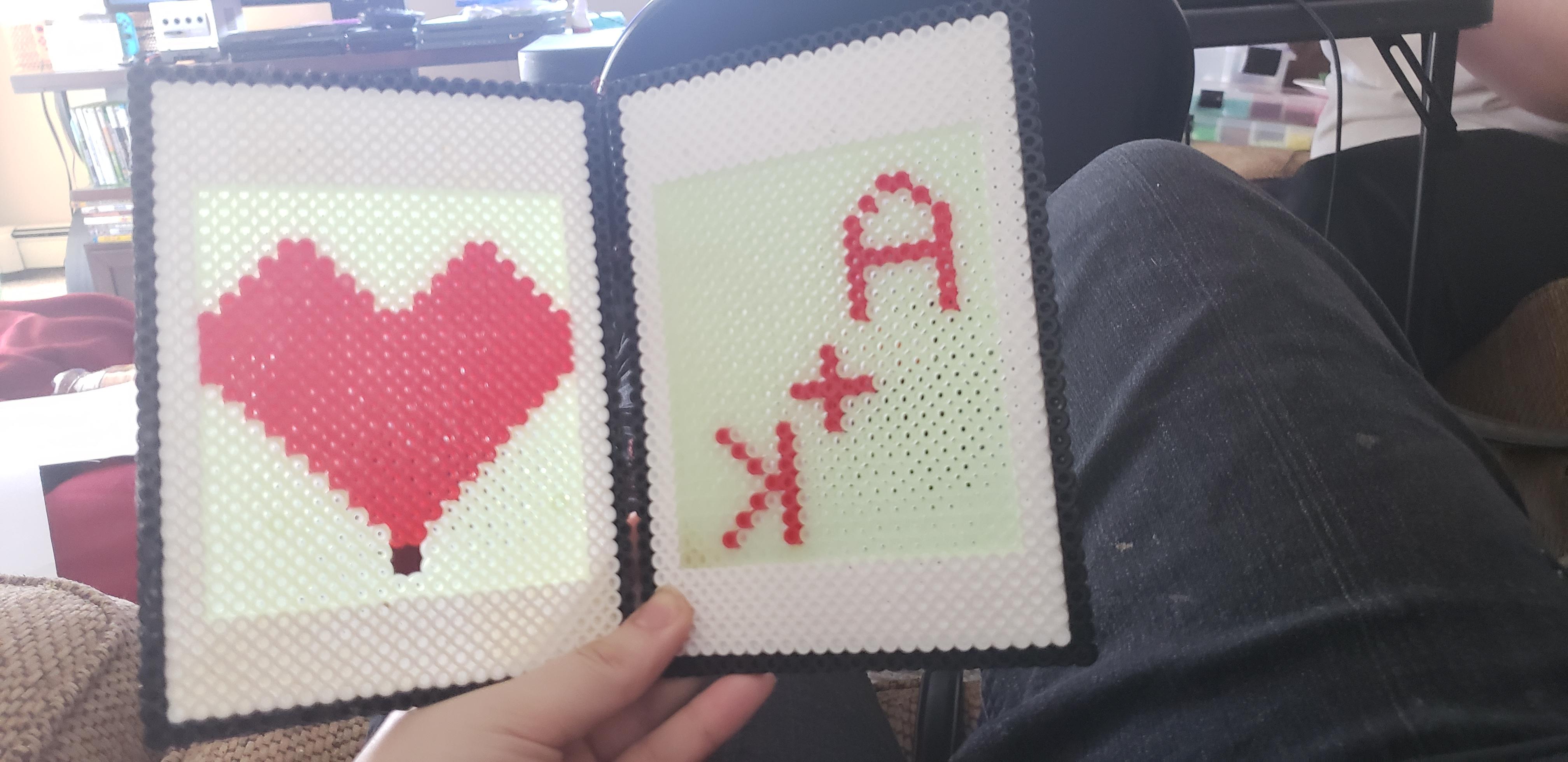 Made my boyfriend an anniversary card out of all perler beads, binding
