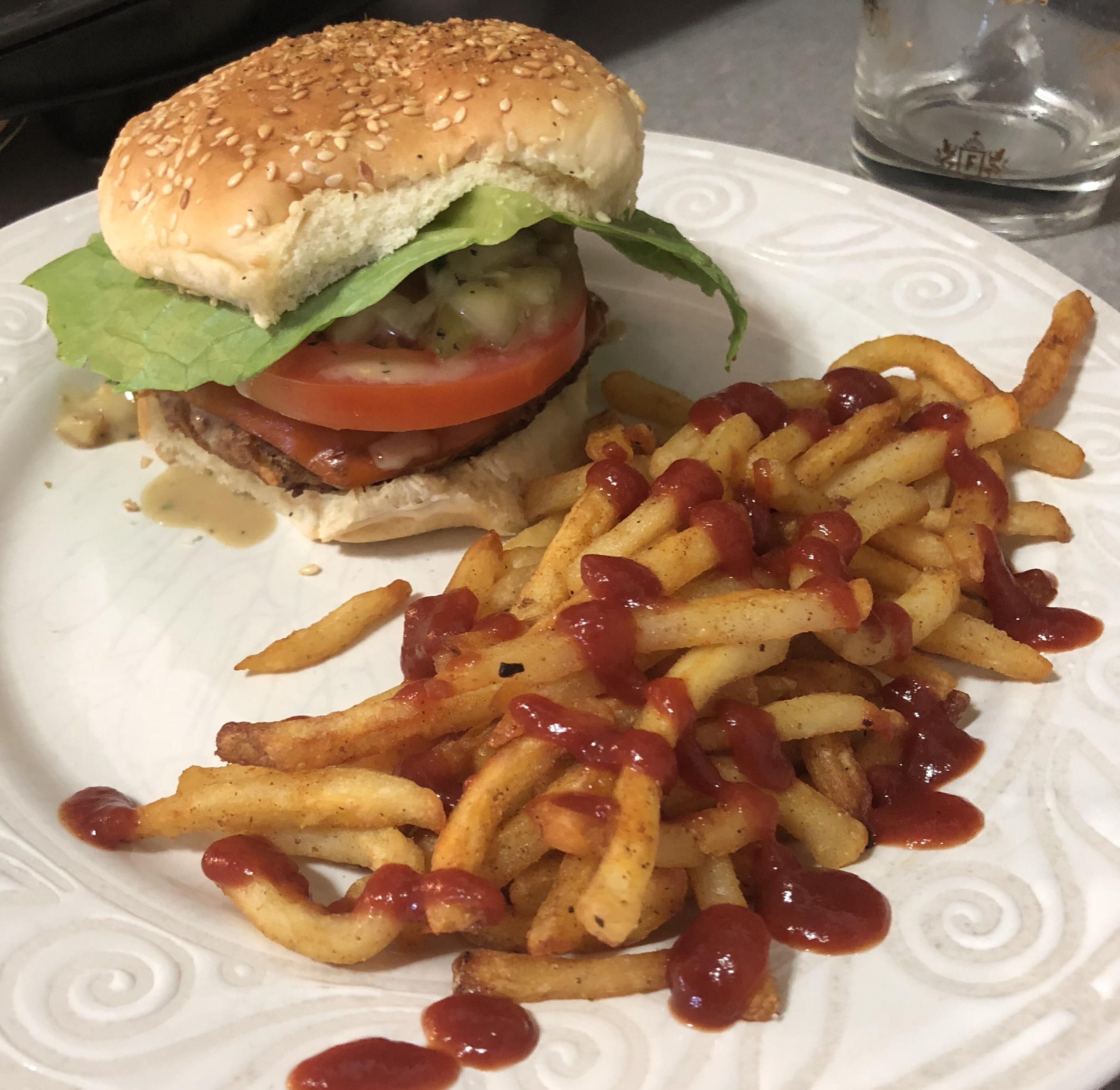 Vegan cheeseburger. Beyond burger patty stuffed with diced sautéed