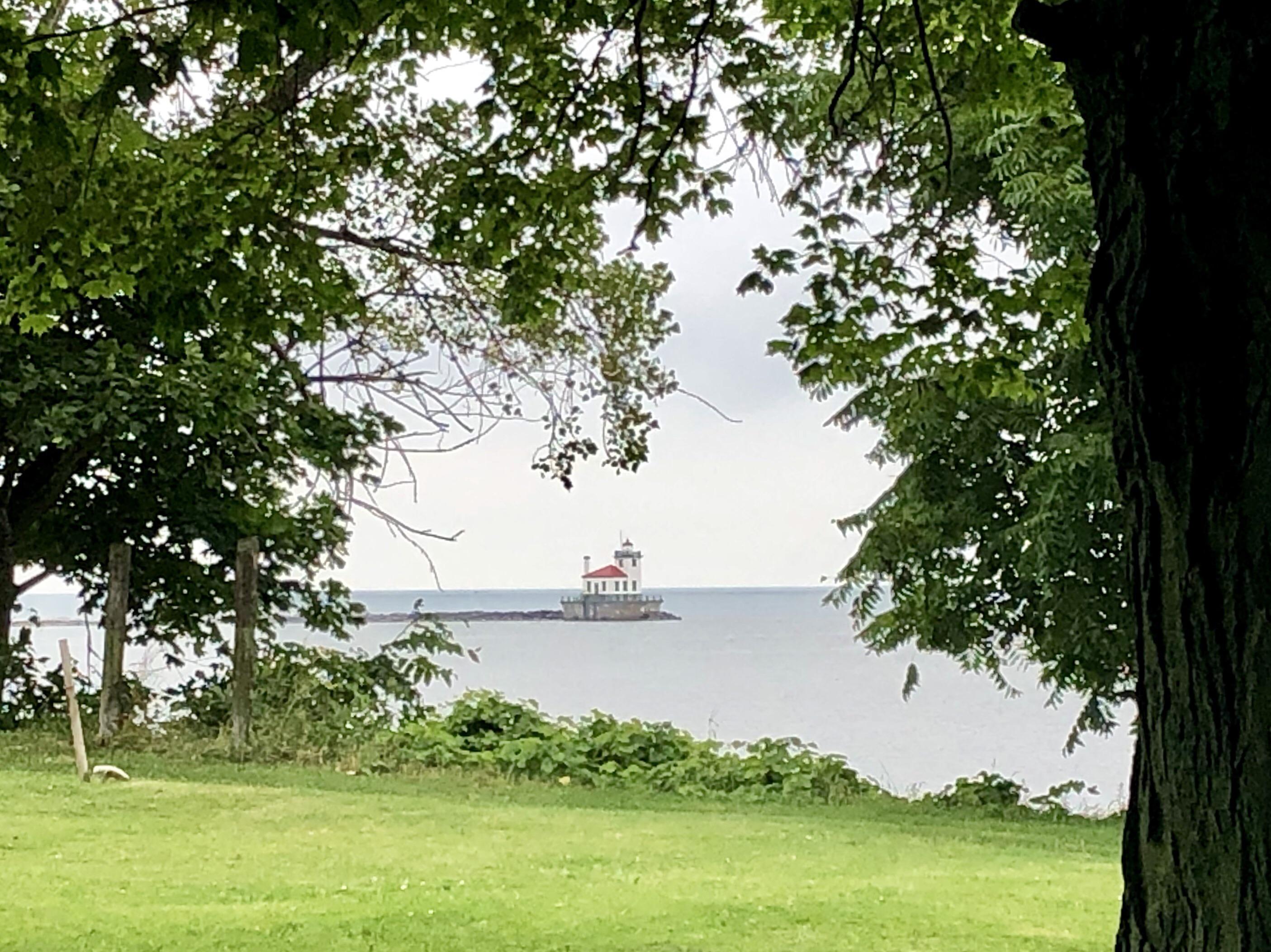 Oswego Harbor Light. Oswego, NY as seen from the cemetery at Fort