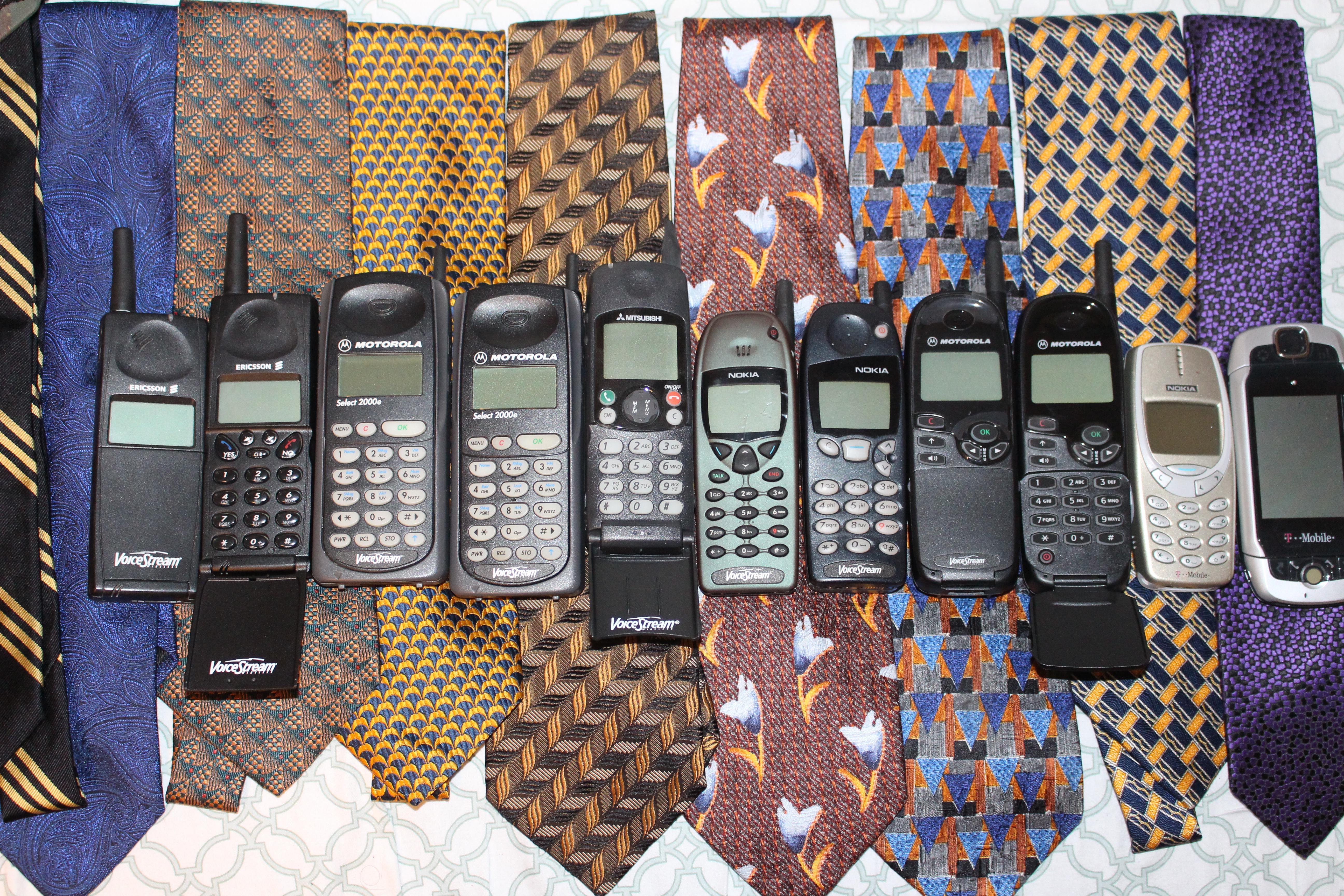 Some of my phones from back in the day, along with some of the ties I used to wear back them