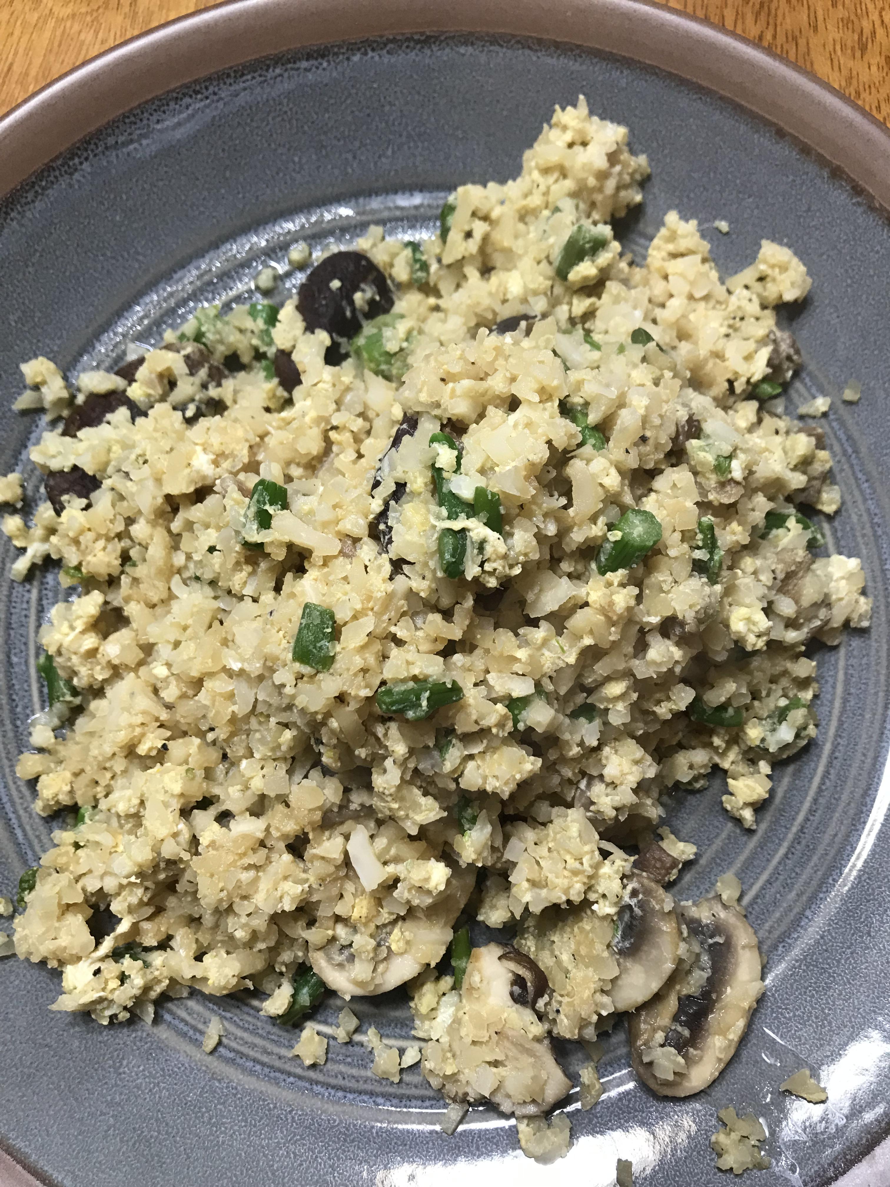 Fried riced cauliflower with mushrooms. 21g carbs, 9.5g fiber, 18g