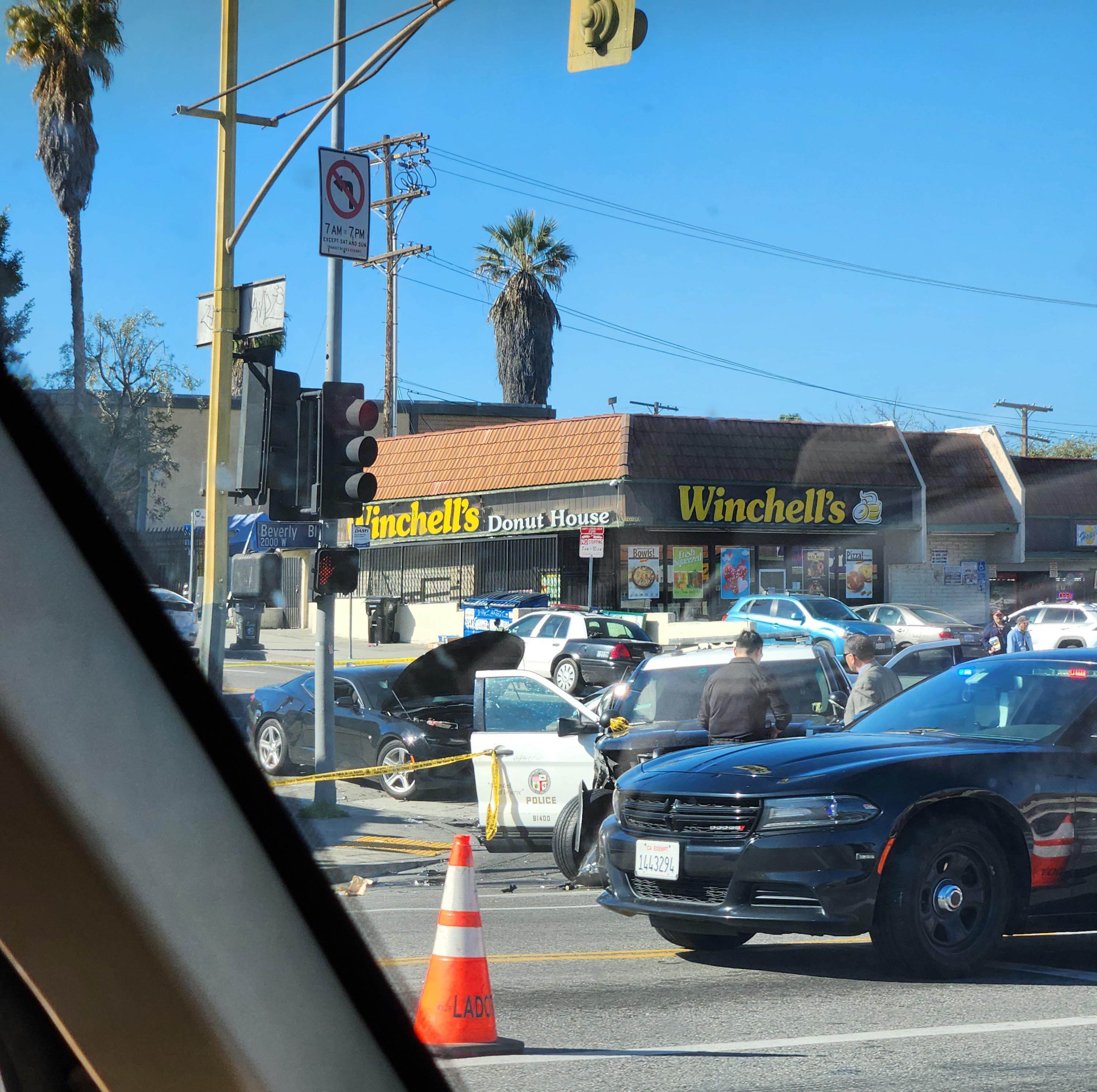 On the corner of Alvarado St and Beverly Blvd a Camaro and Prius(hidden behind the cop vehicle