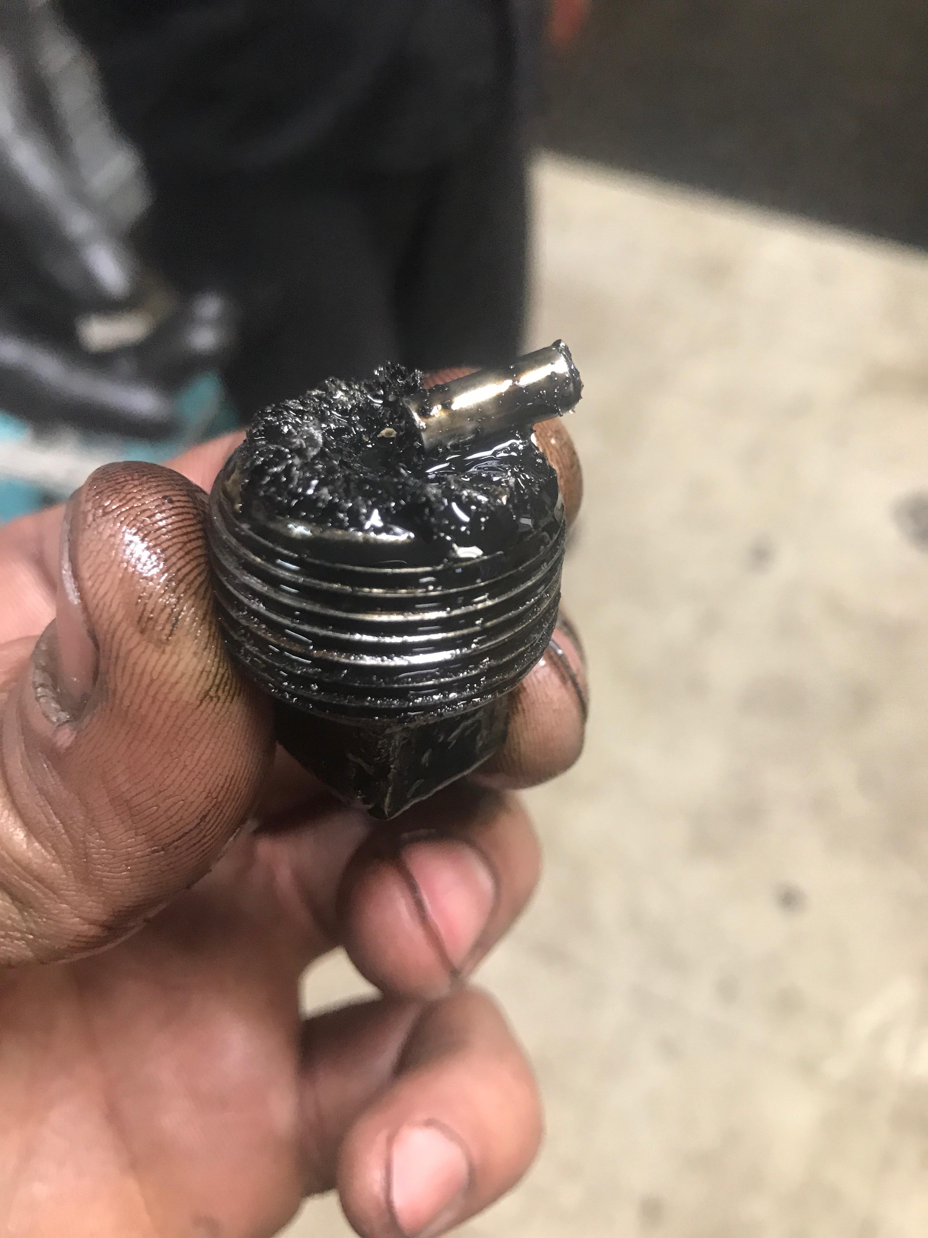 Help Identify metal found — mechanic found in oil pan after rebuild by