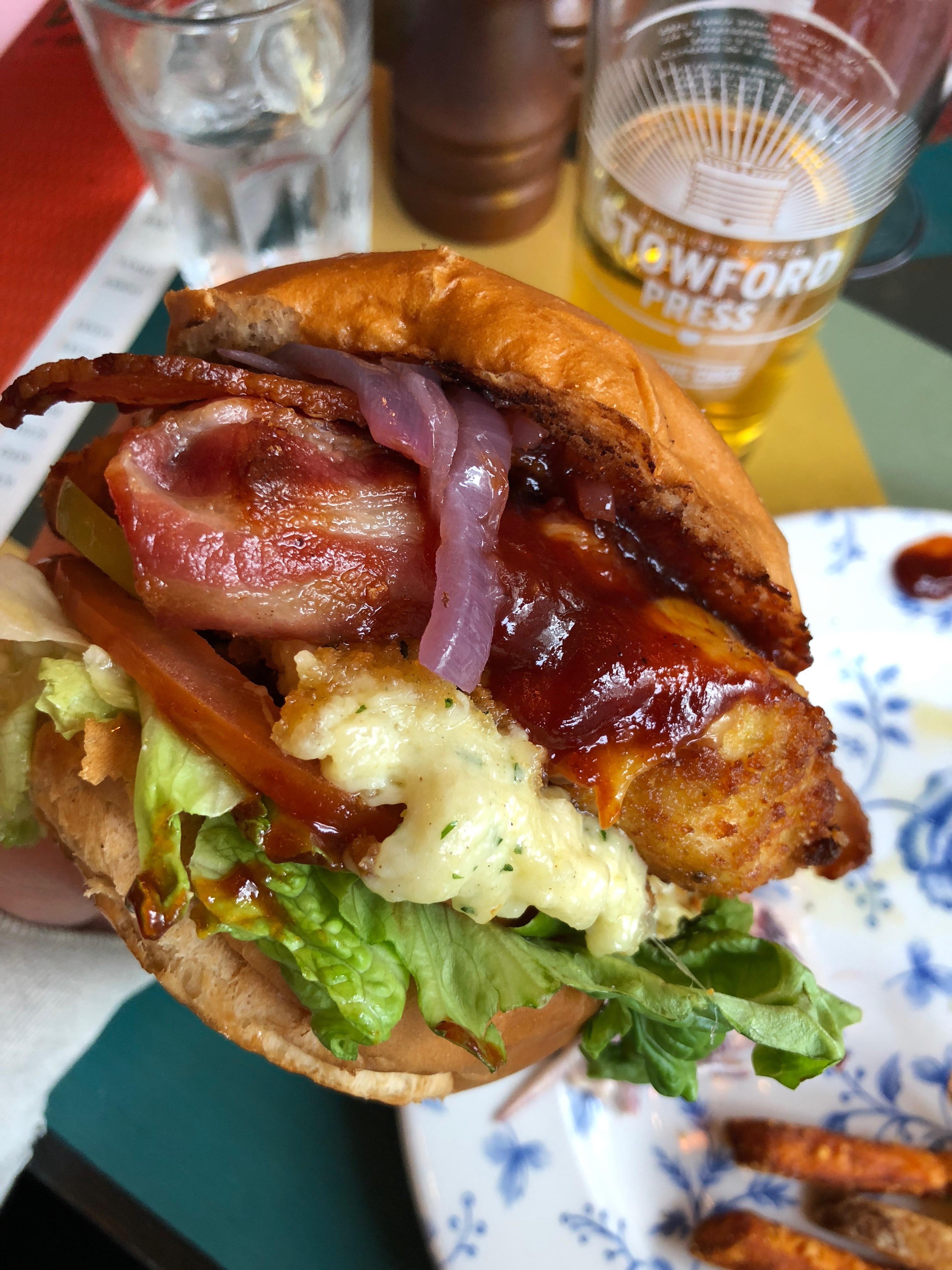 Fried chicken sandwich with mac and cheese fritter and smoked bacon