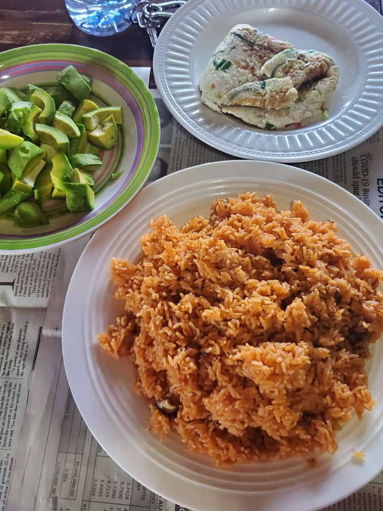 Ghanaian Jollof Rice, Avocados and a Fried Omelette Tema, Ghana r