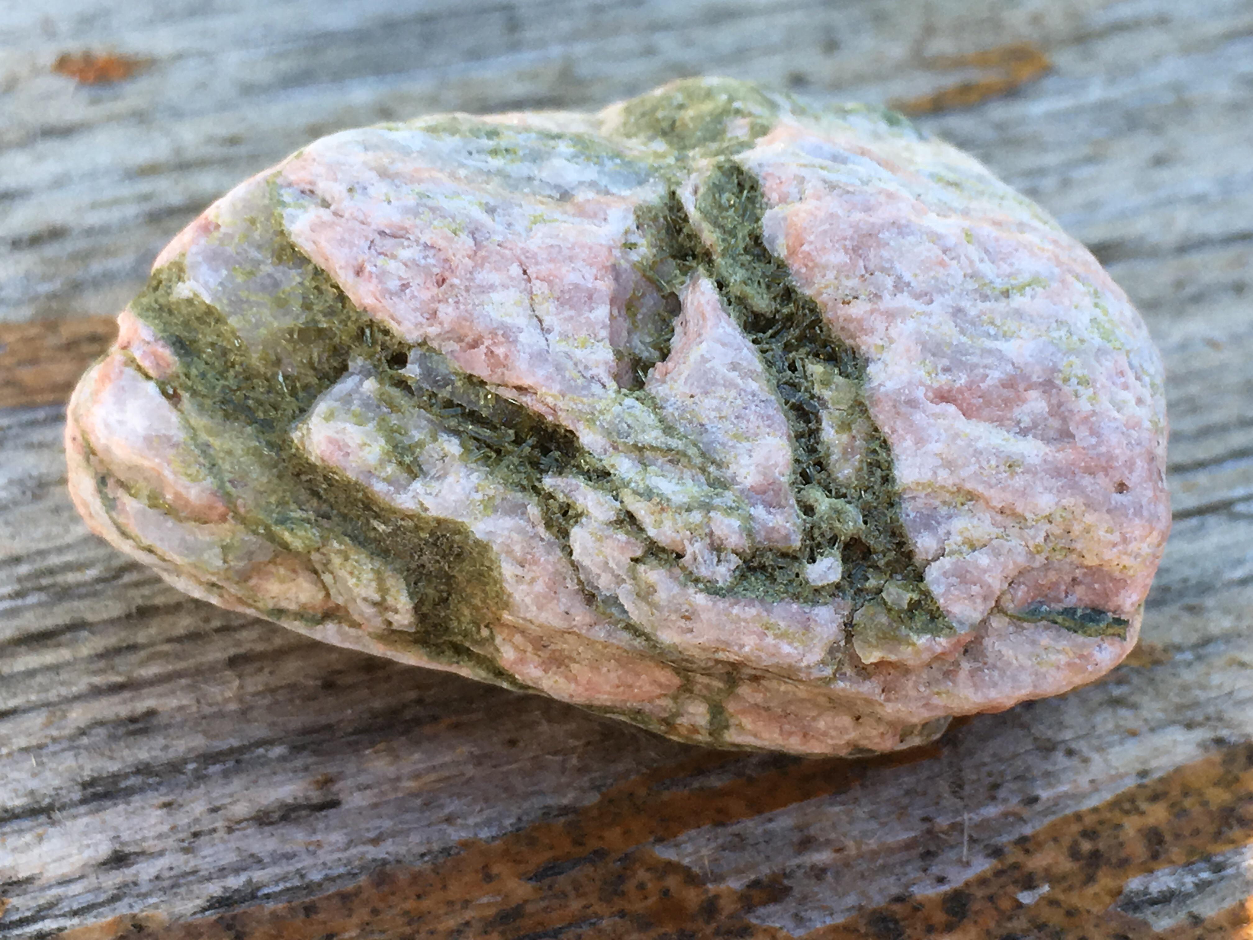 Epidote in red granite that i found on my vacation last month r/geology
