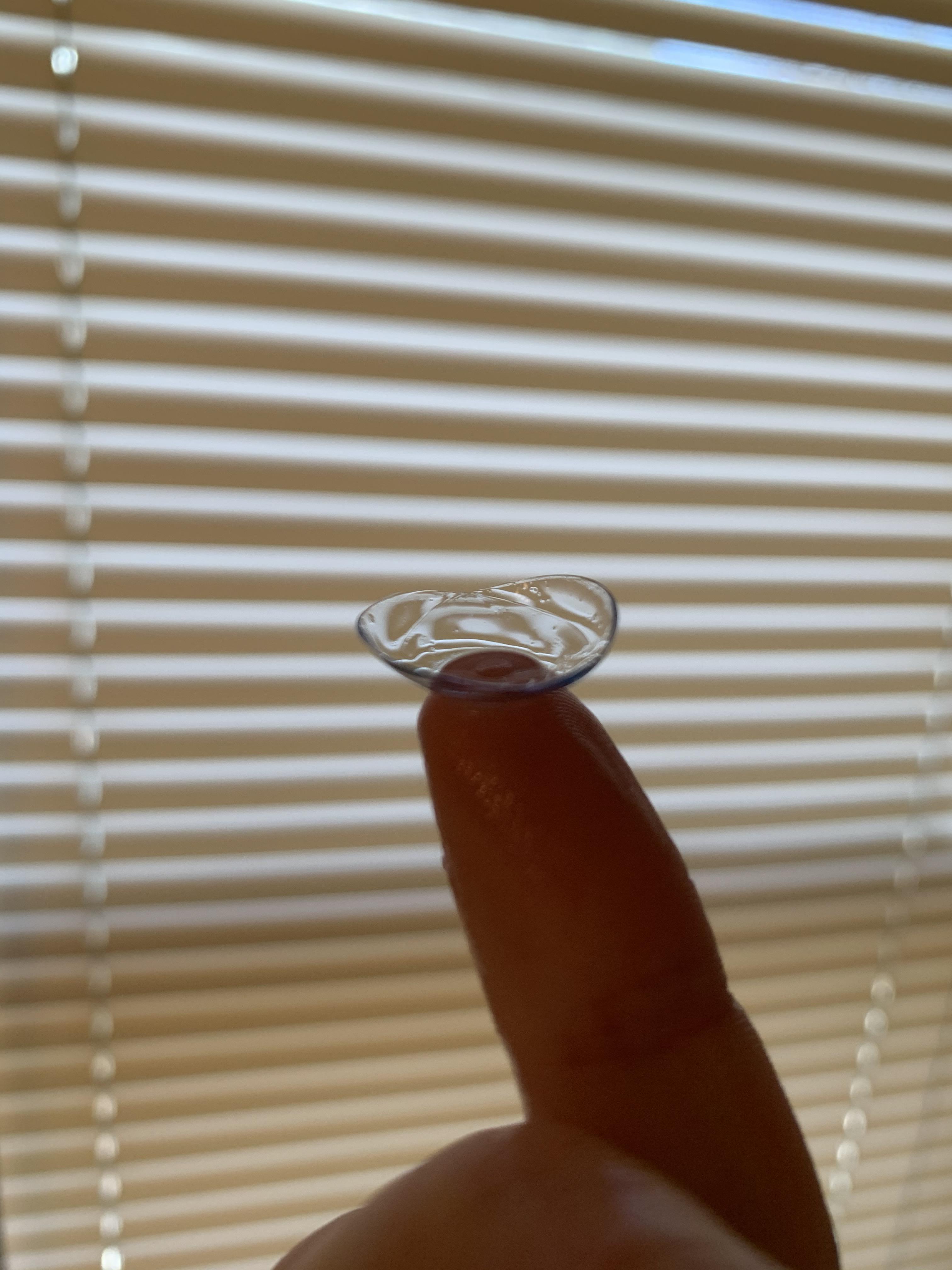 This defective contact lens appears to be two lenses fused together r