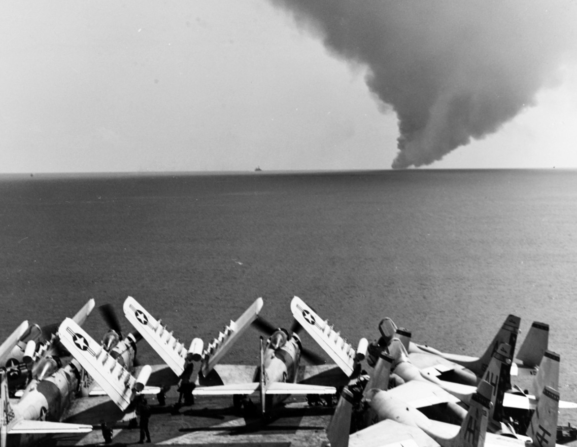 The Forrestal burns in the distance, taken from the flight deck of the