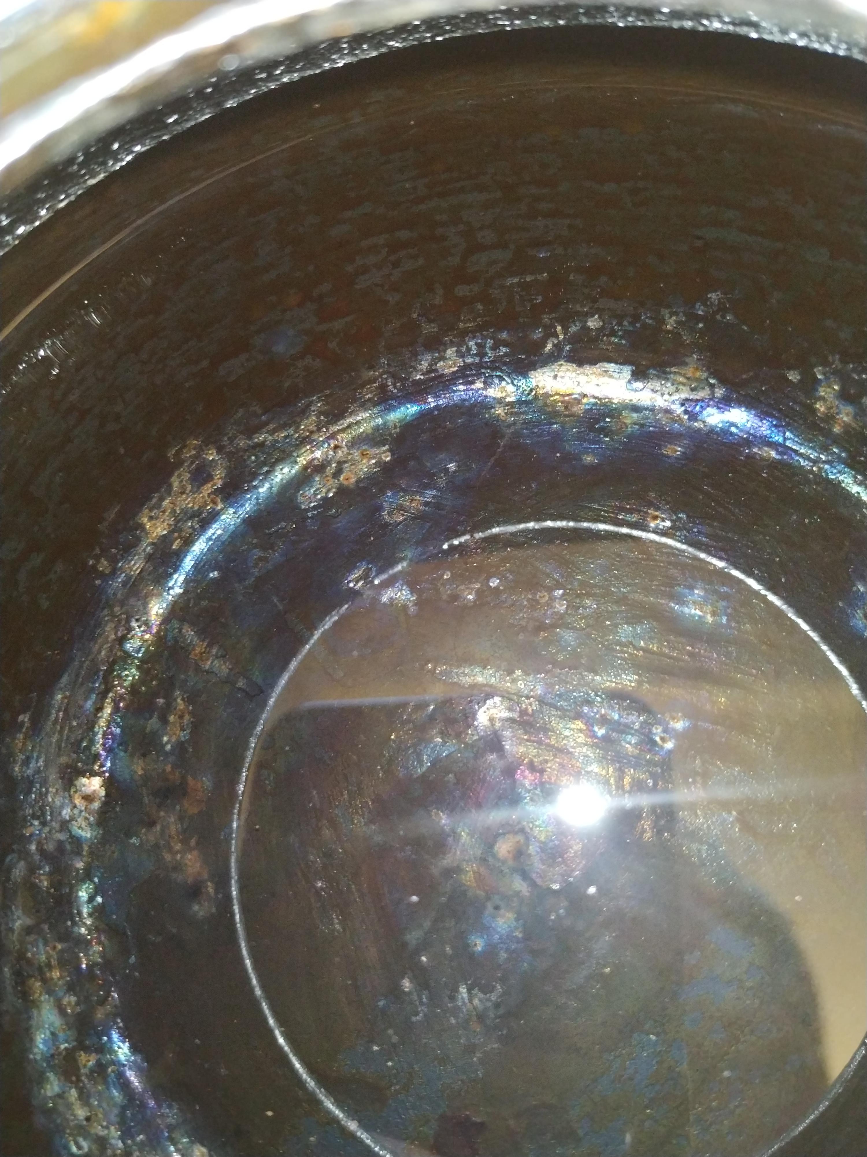 My cast iron teapot is iridescent on the inside after I`ve