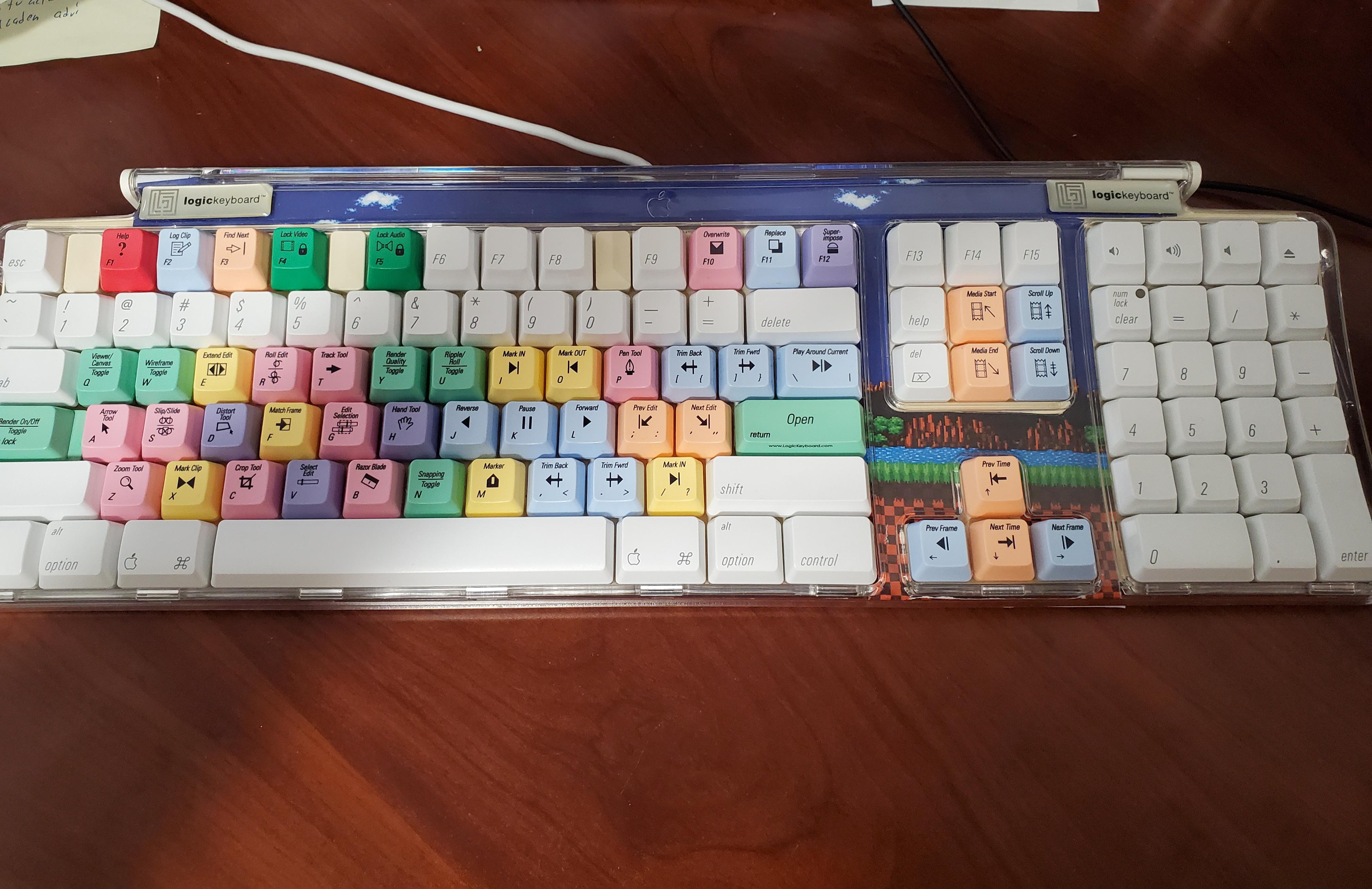 Custom keyboard I made. Keys from 3 old Mac keyboards, colored ones
