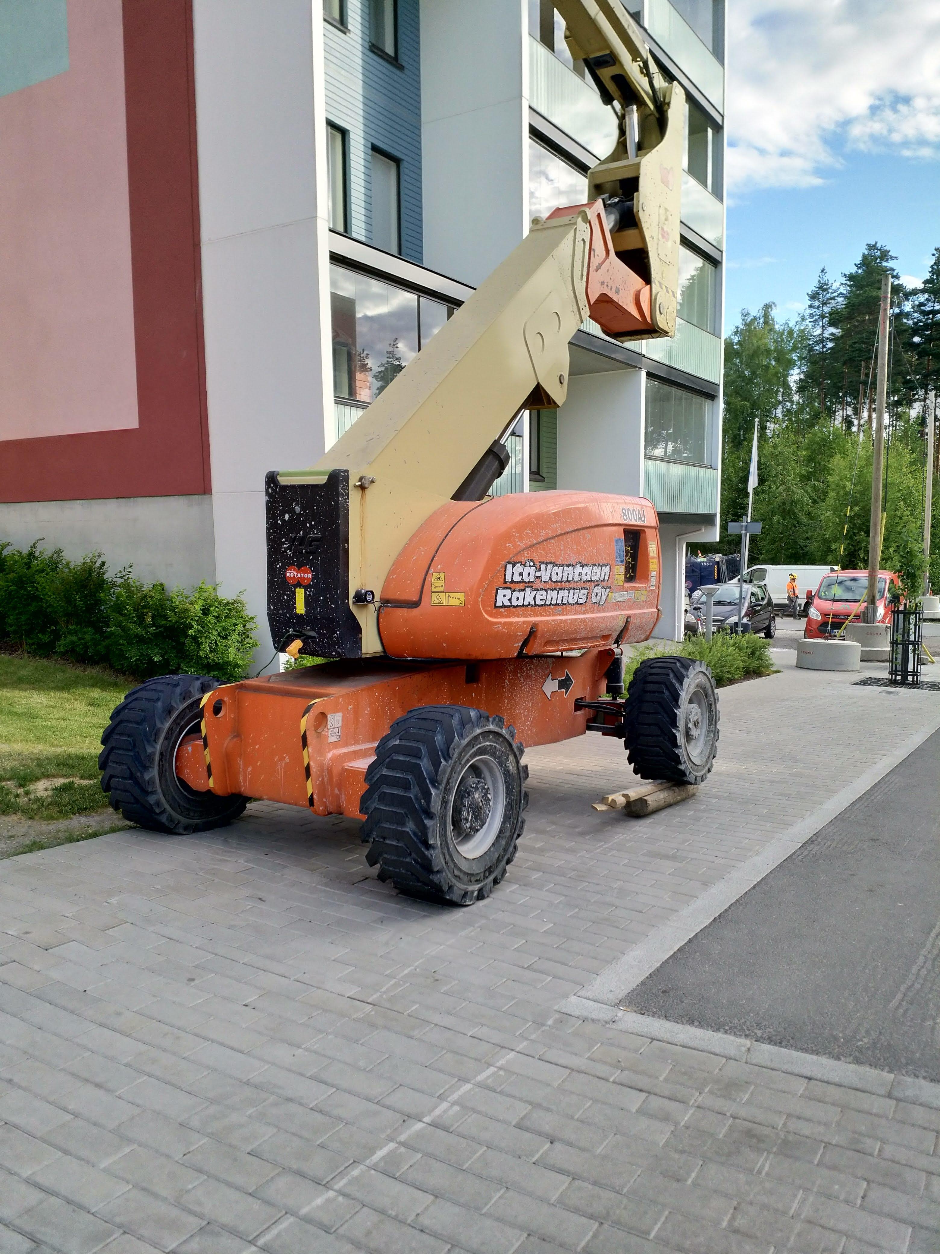 If the slope is too steep to operate a boom lift, just stack wood under