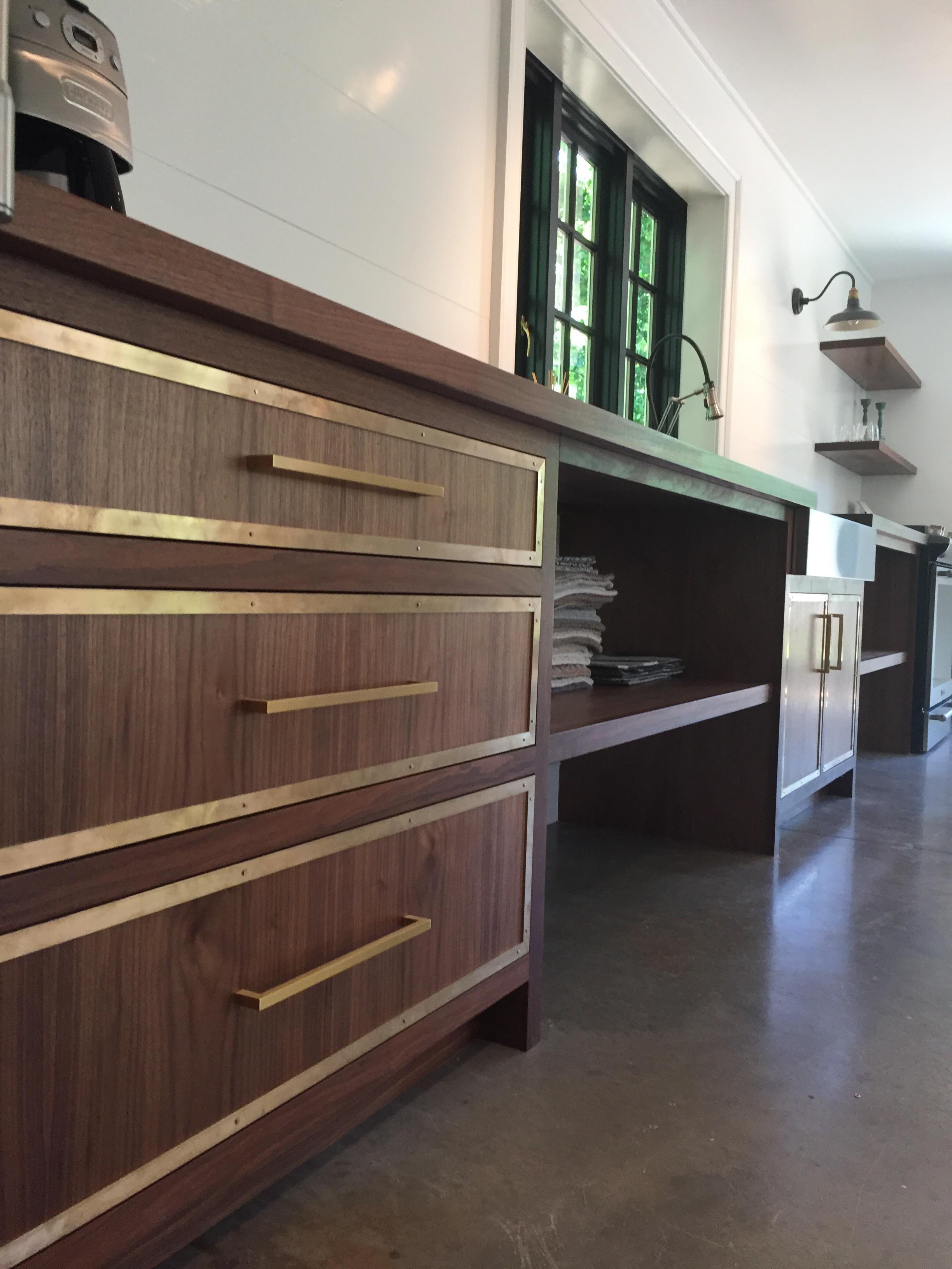 Some walnut with hand riveted brass trim that I recently made