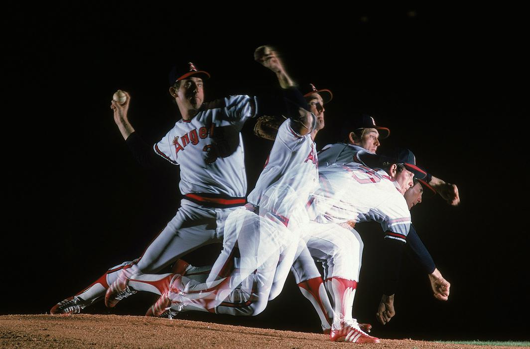 Multiple exposure view of California Angels Nolan Ryan pitching on day
