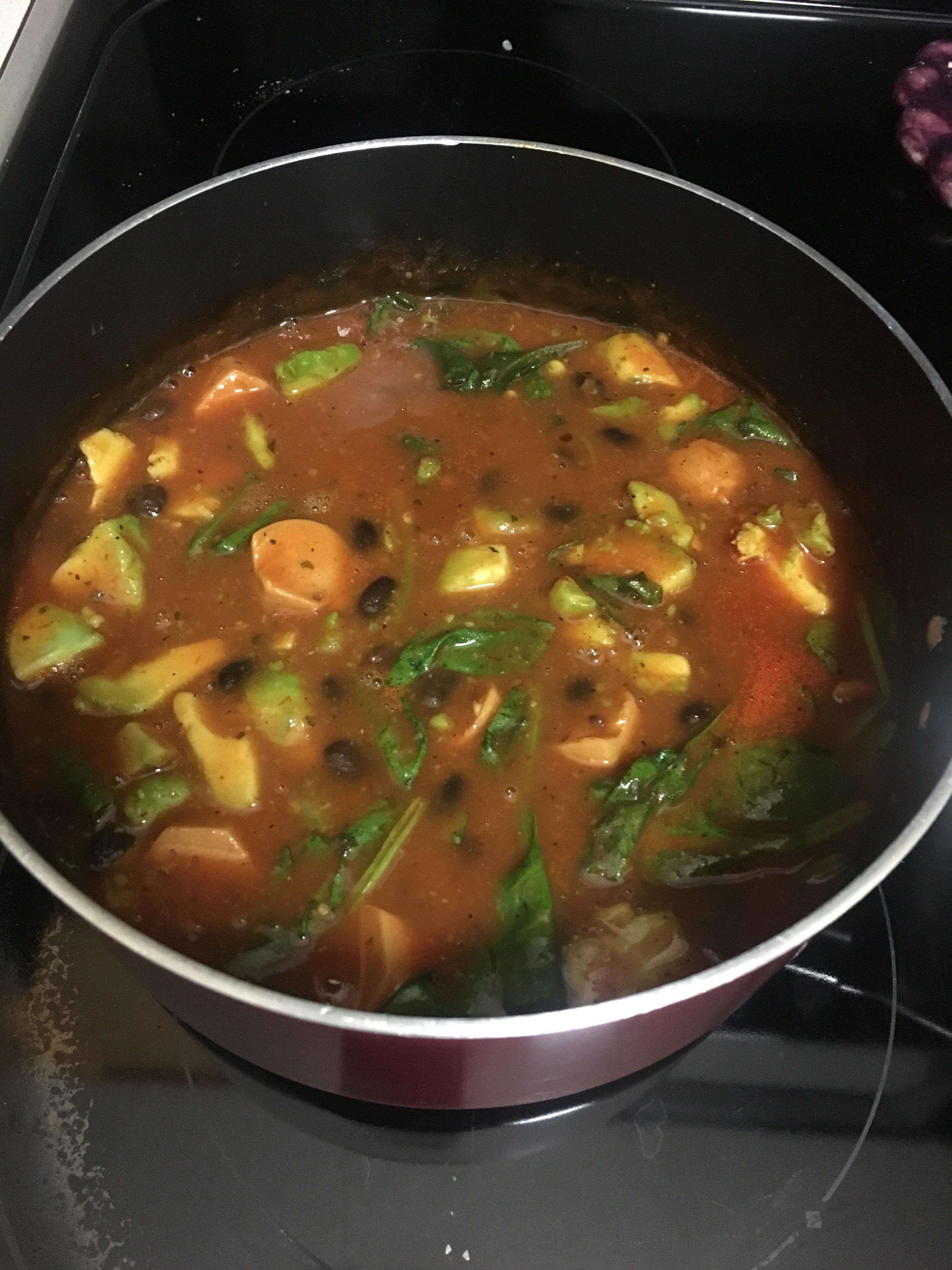 Started off as tomato soup with spinach, black beans, and avocado. Then