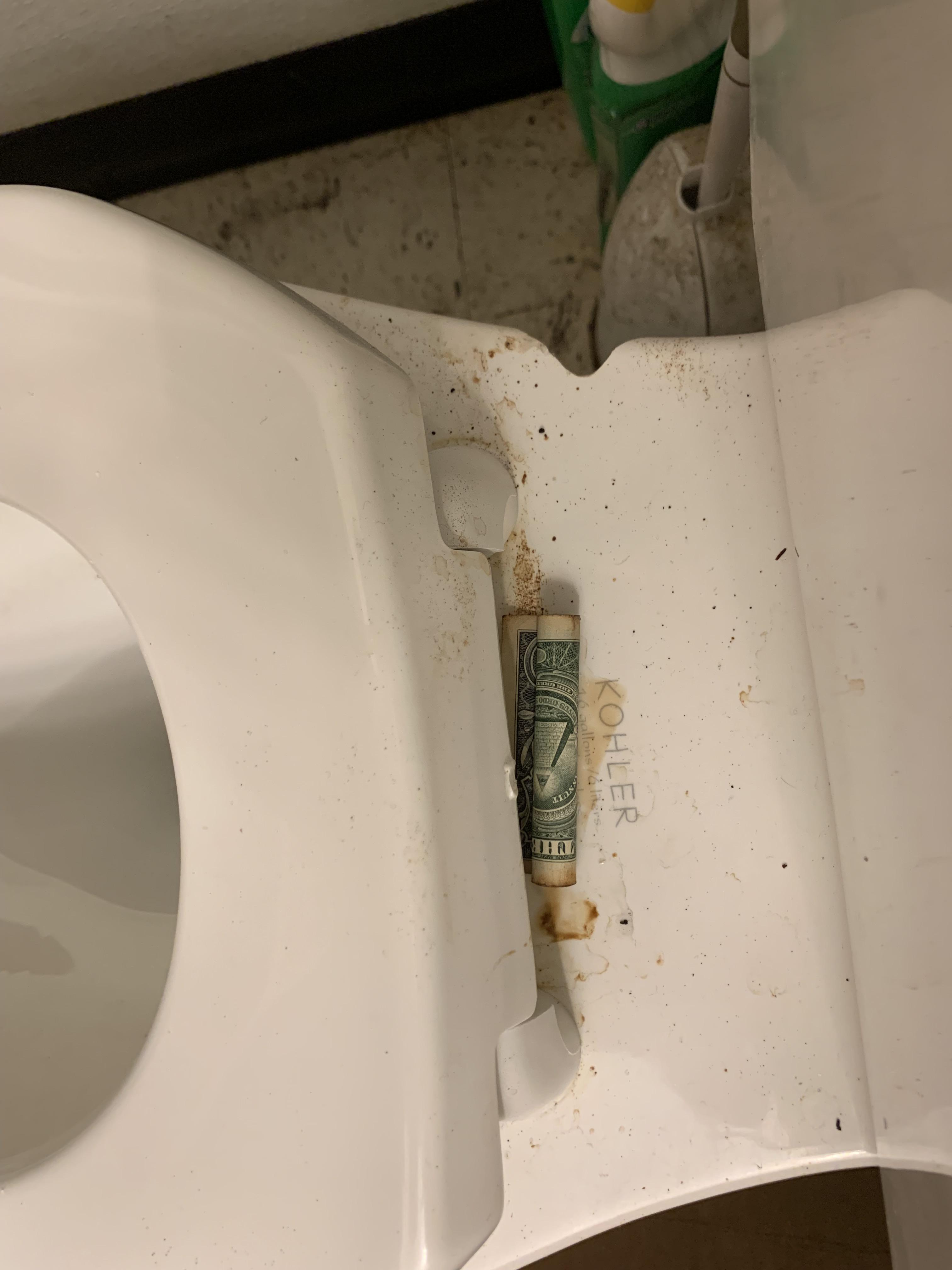 Rolled up bill under the toilet lid at my LC location r/LittleCaesars