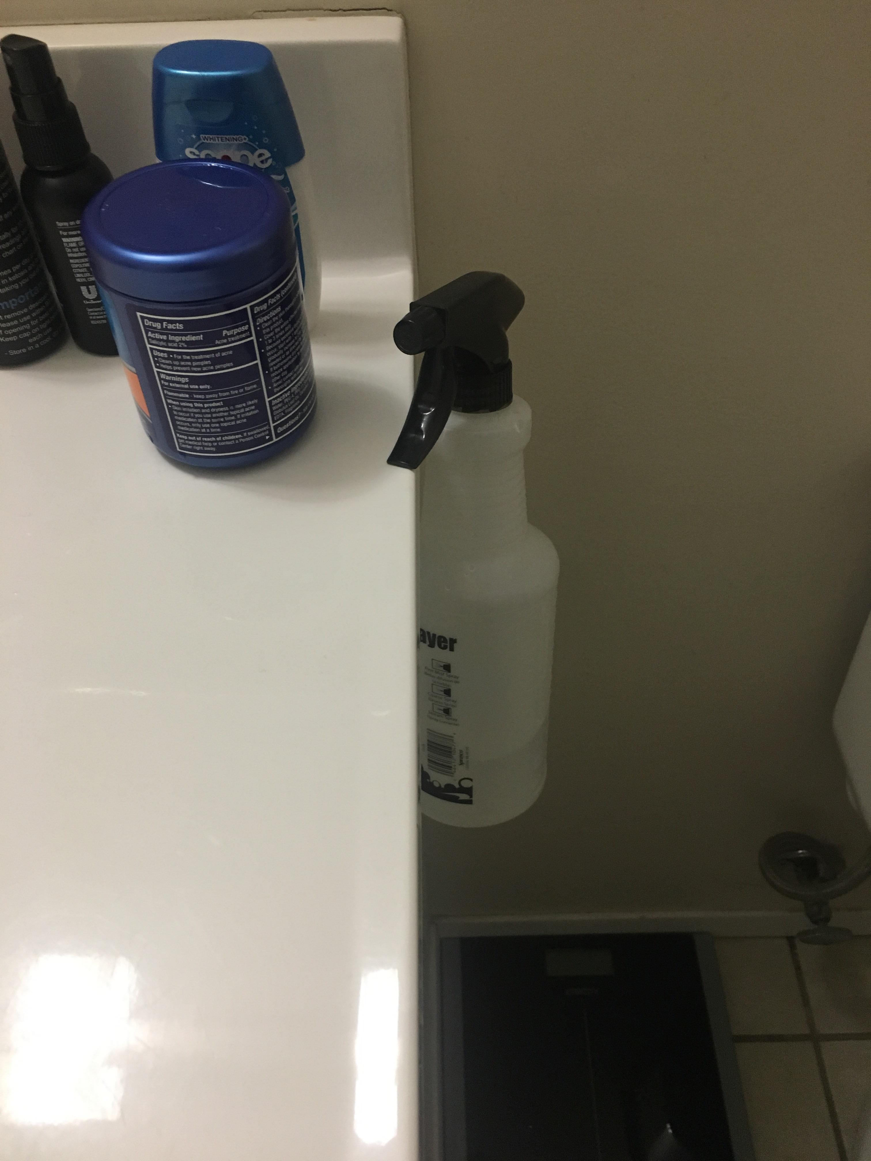 A spray bottle almost fell off my bathroom sink and landed like this... r/Whataretheodds