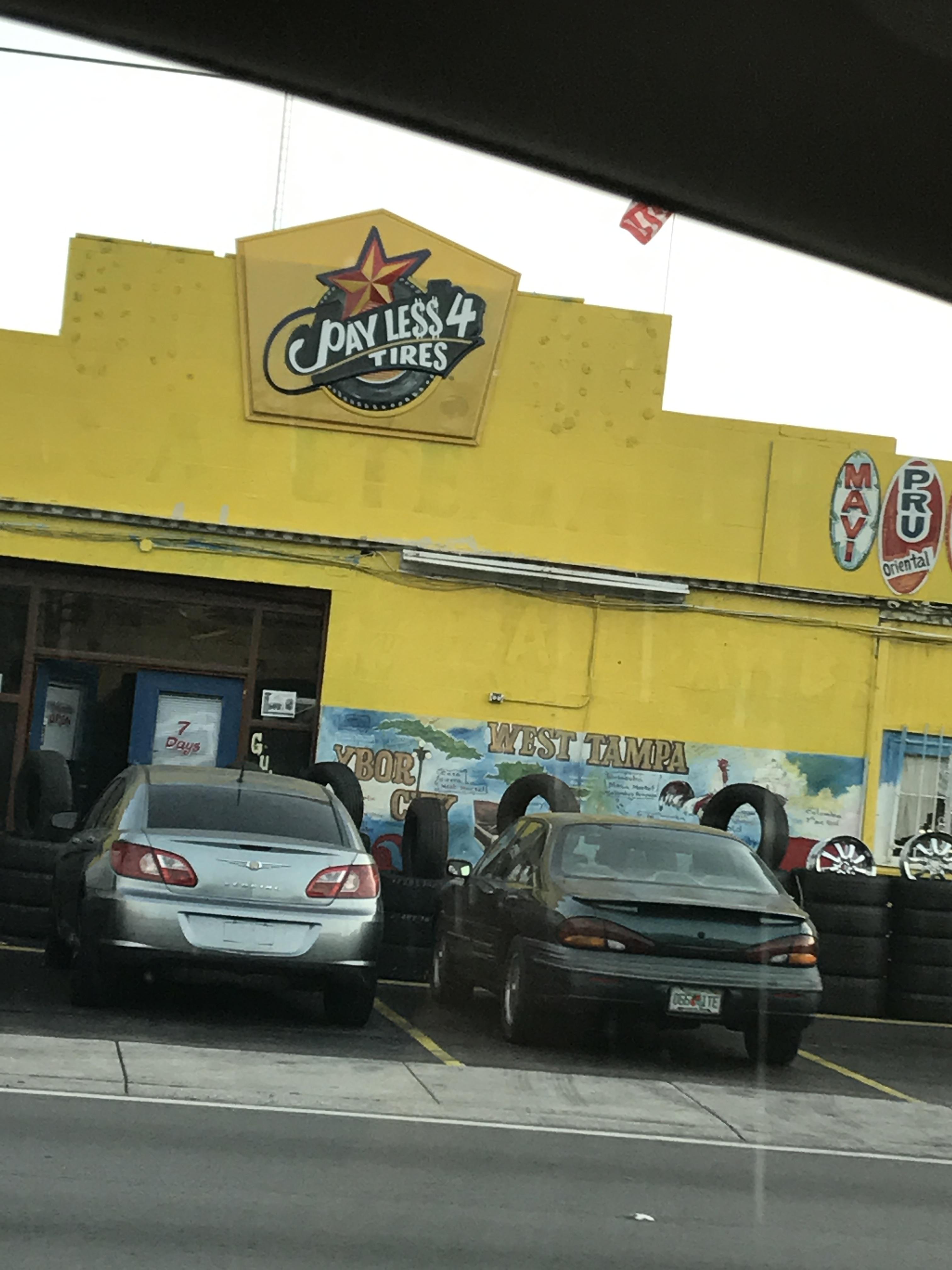 Tire shop reused an old Church's Chicken sign for their sign r