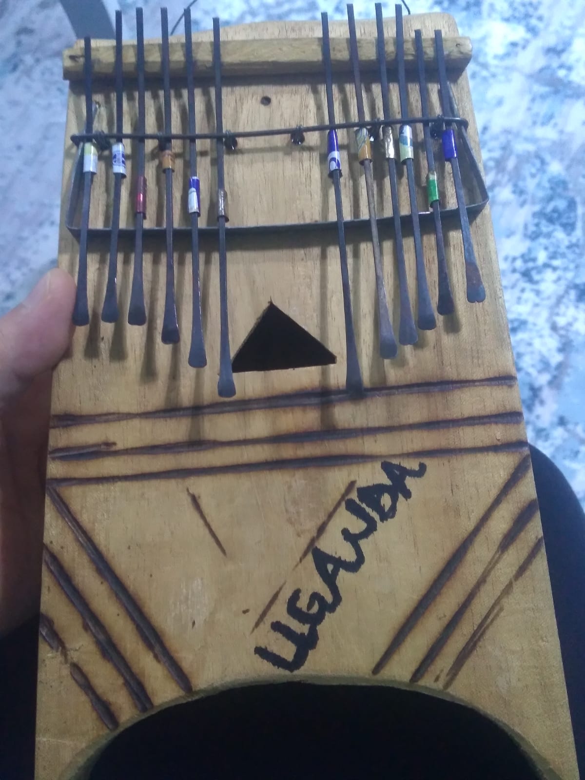 The handmade kalimba my friend brought me as a gift from Uganda. r