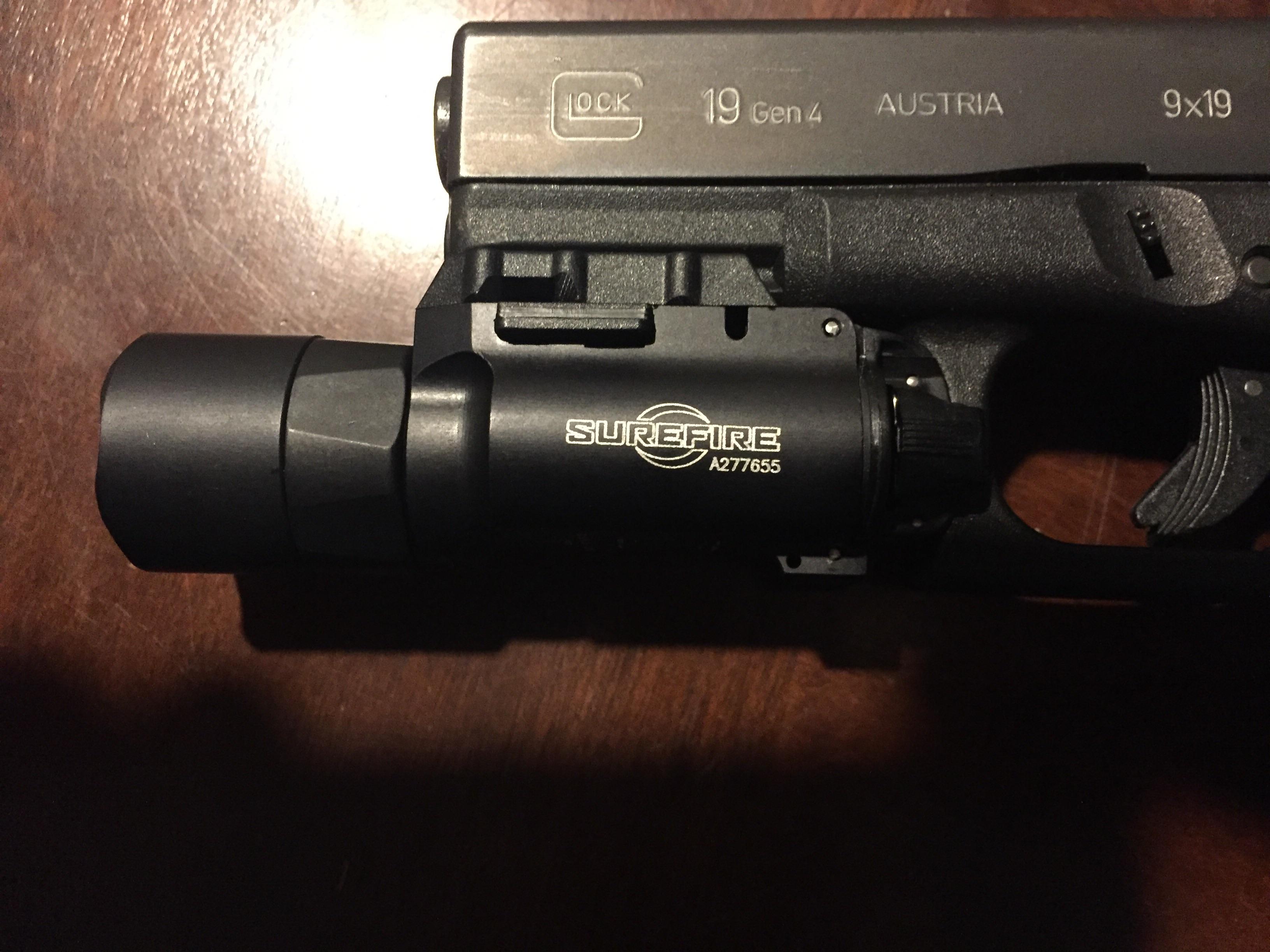Here's my new Surefire anyone else have any pistol mounted flashlights