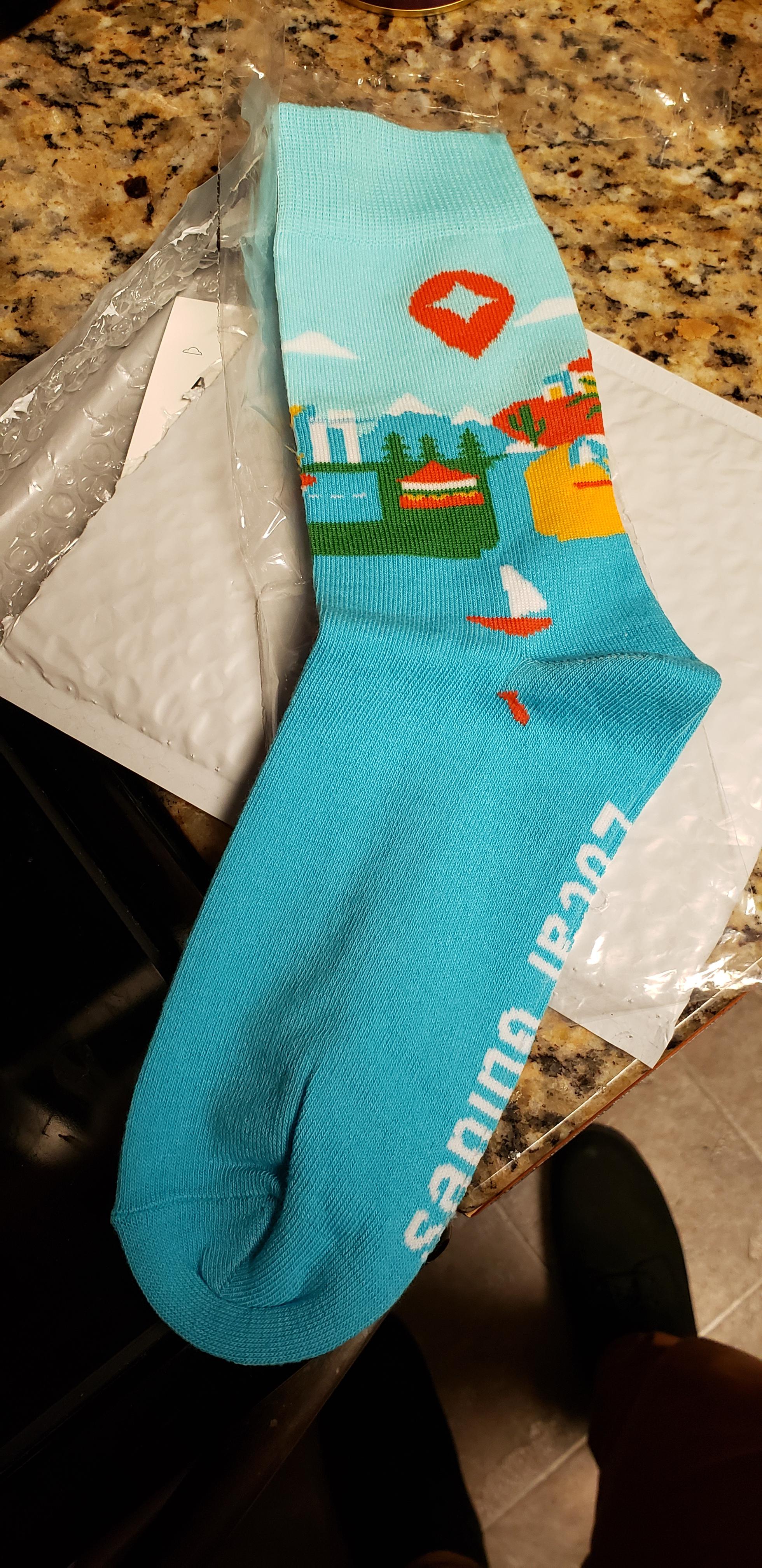 Just got my socks! Level 5, USA. But I did get the redemption code at