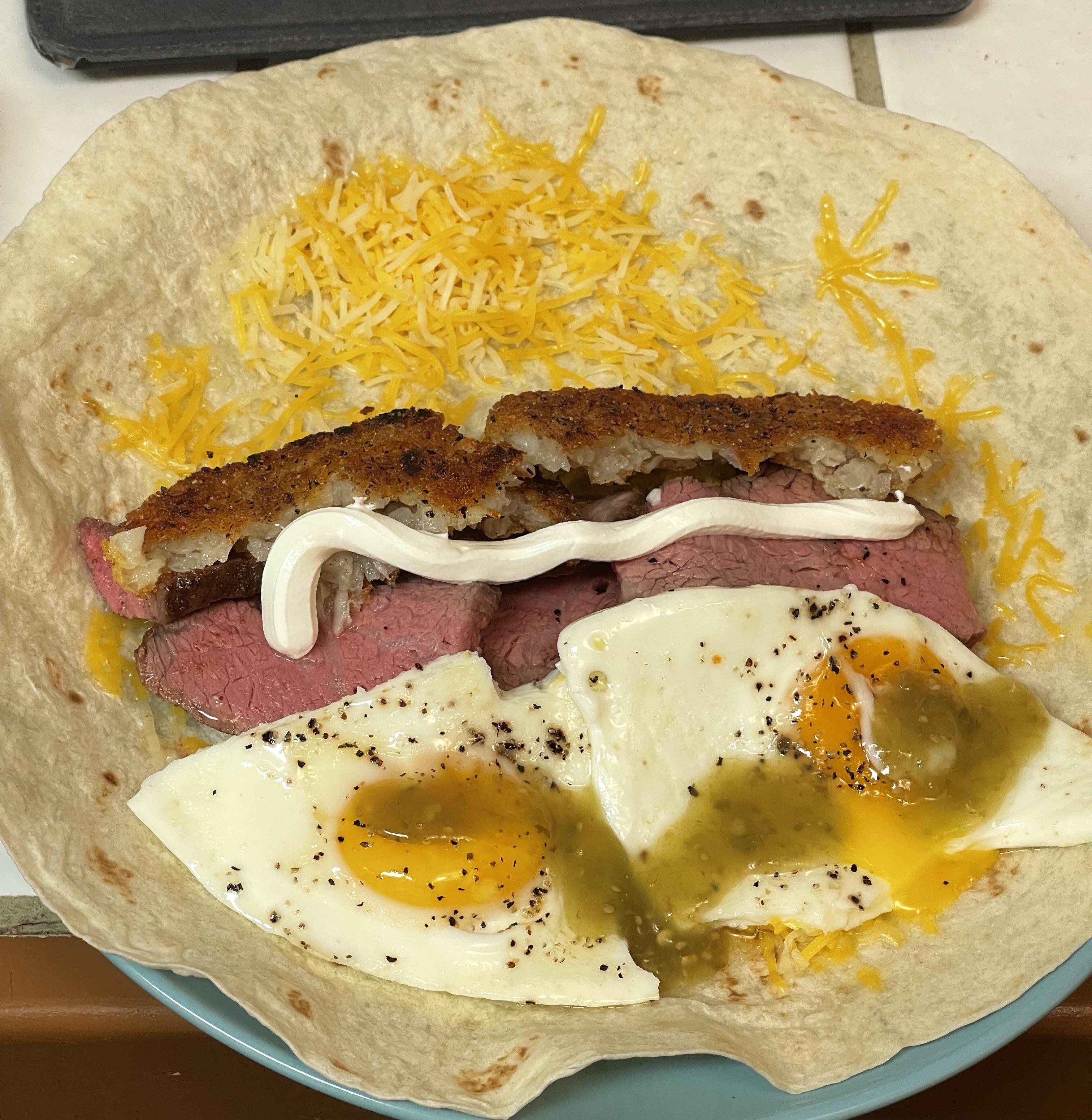 Tri Tip and Hash brown breakfast burrito with salsa verde r