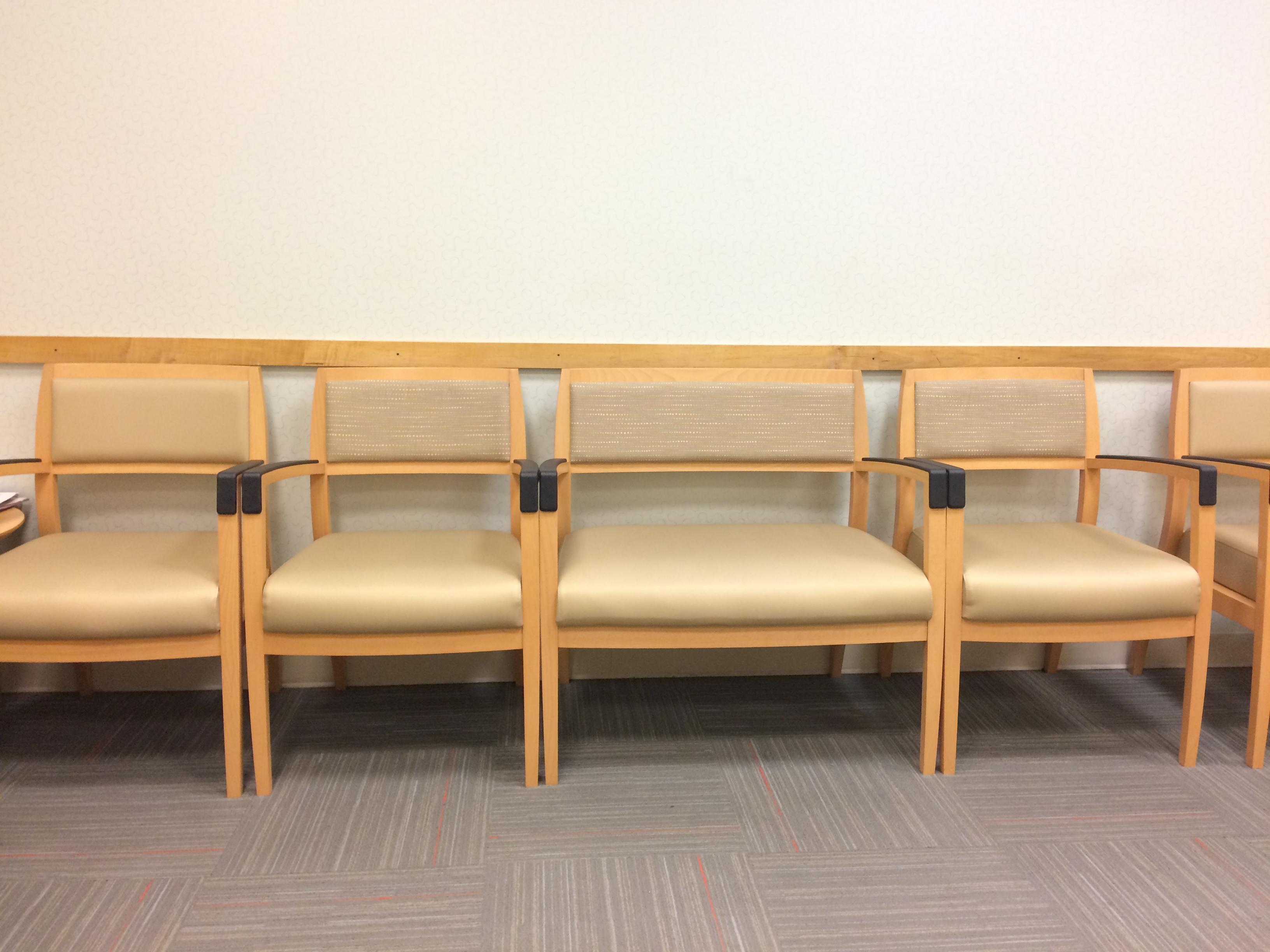 This waiting room has an extra large chair for an extra large person