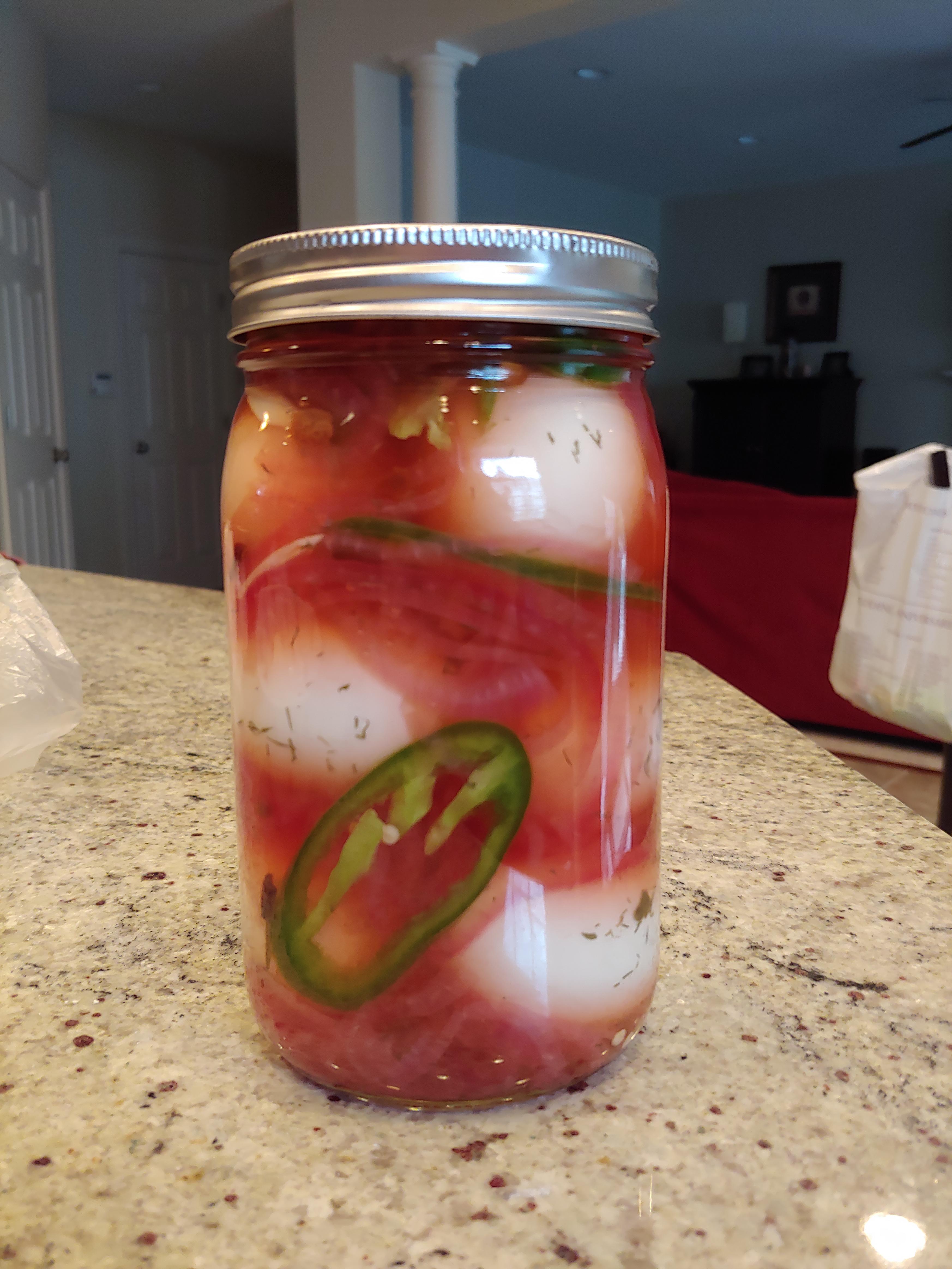 . Y first stab at spicy pickled eggs, with red onion and peppers r