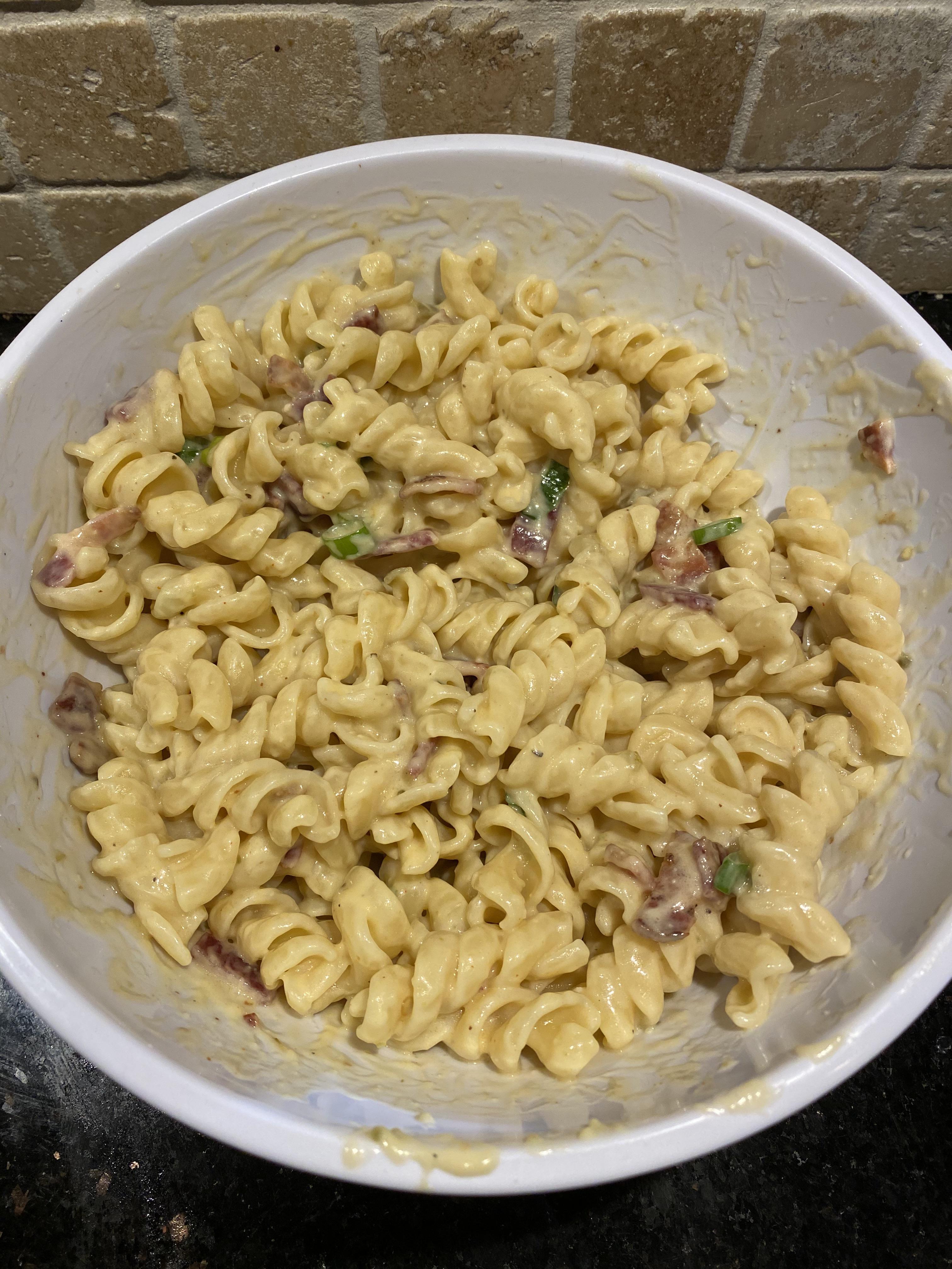 Mac & Cheese... fusilli pasta, white cheddar, bacon, green onion, fire