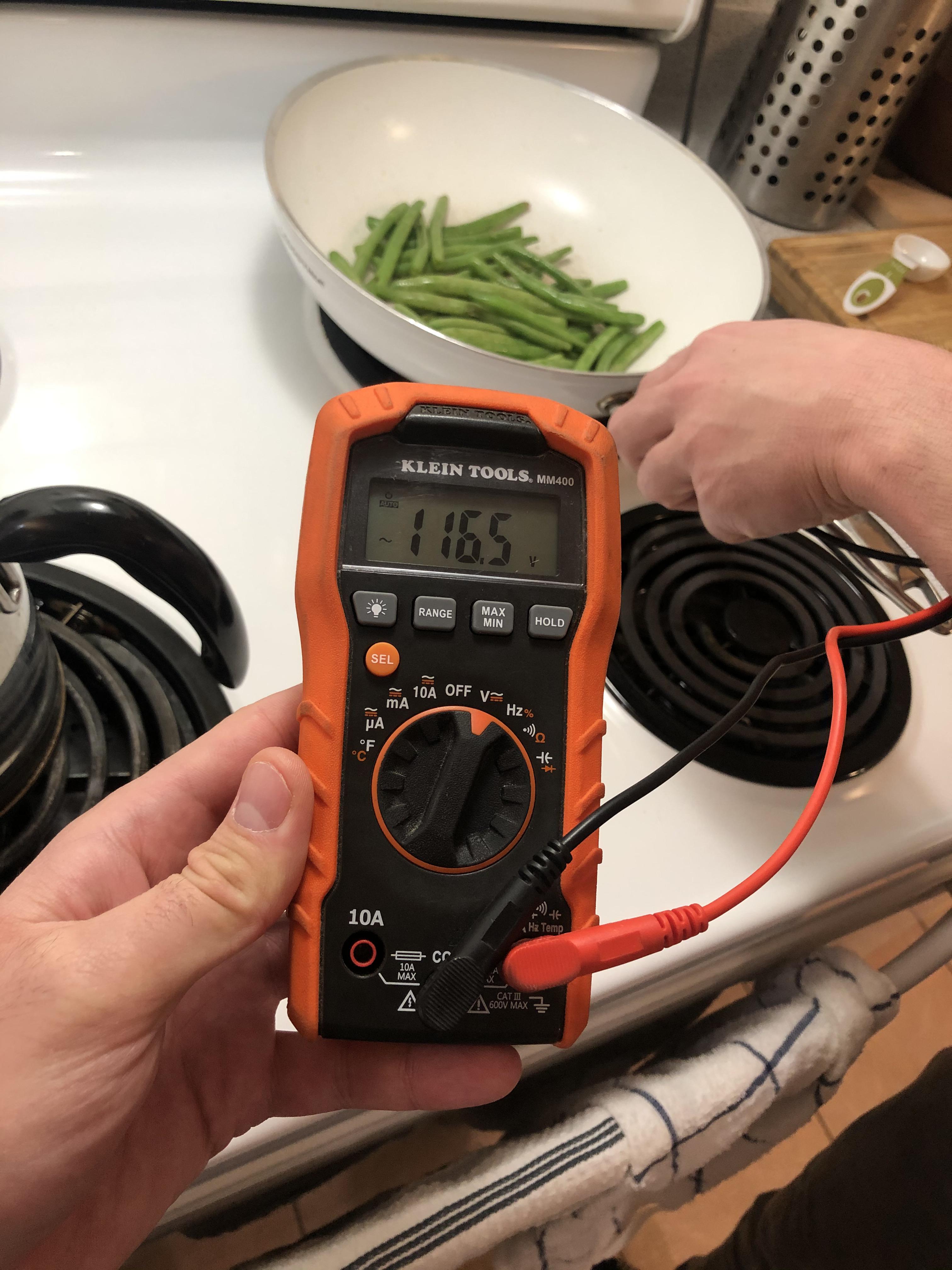 Electric shock when touching pan on stove burner r/electricians