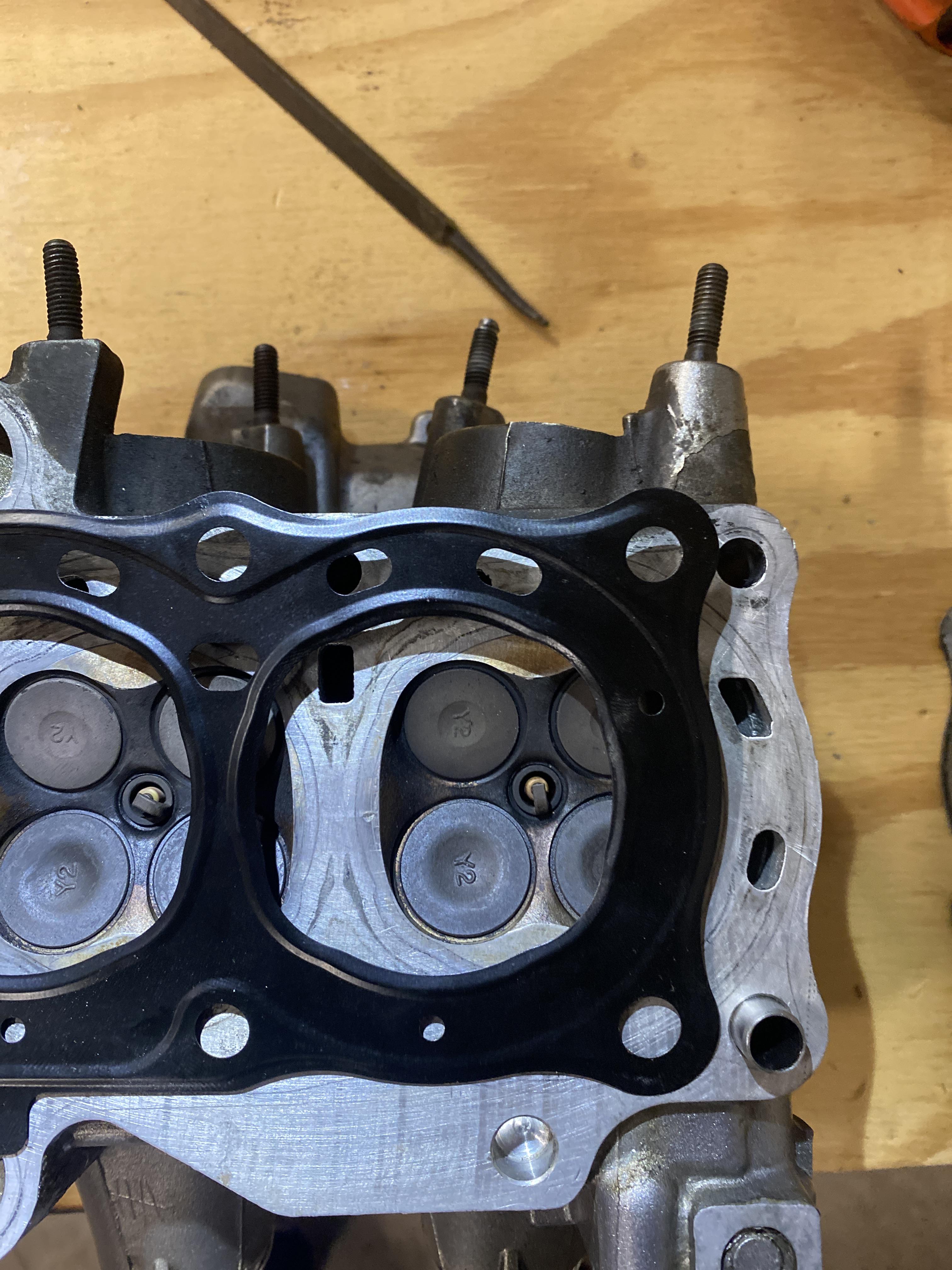 Motorcycle metal head gasket matches the old one. But all the ports are