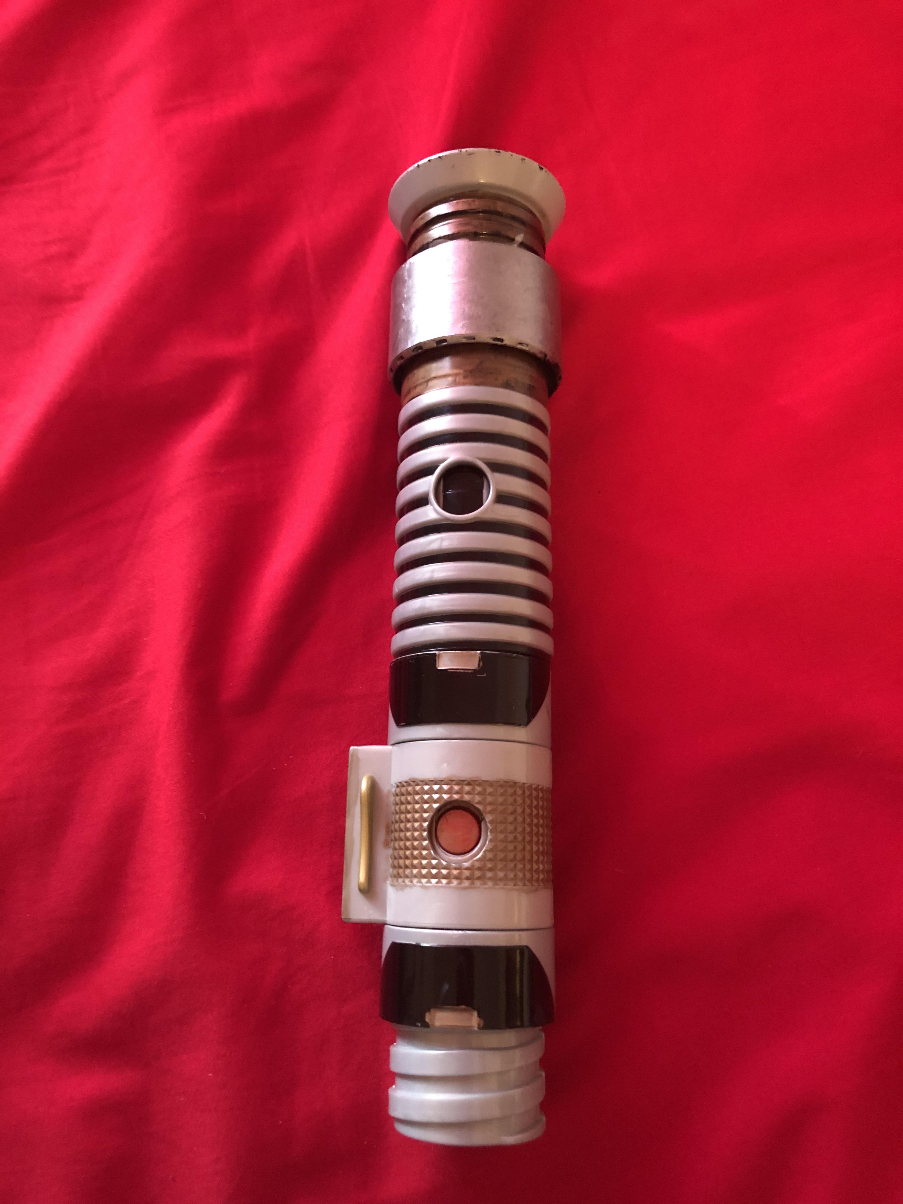 My lightsaber from Disneyland with custom pieces. Does anyone know