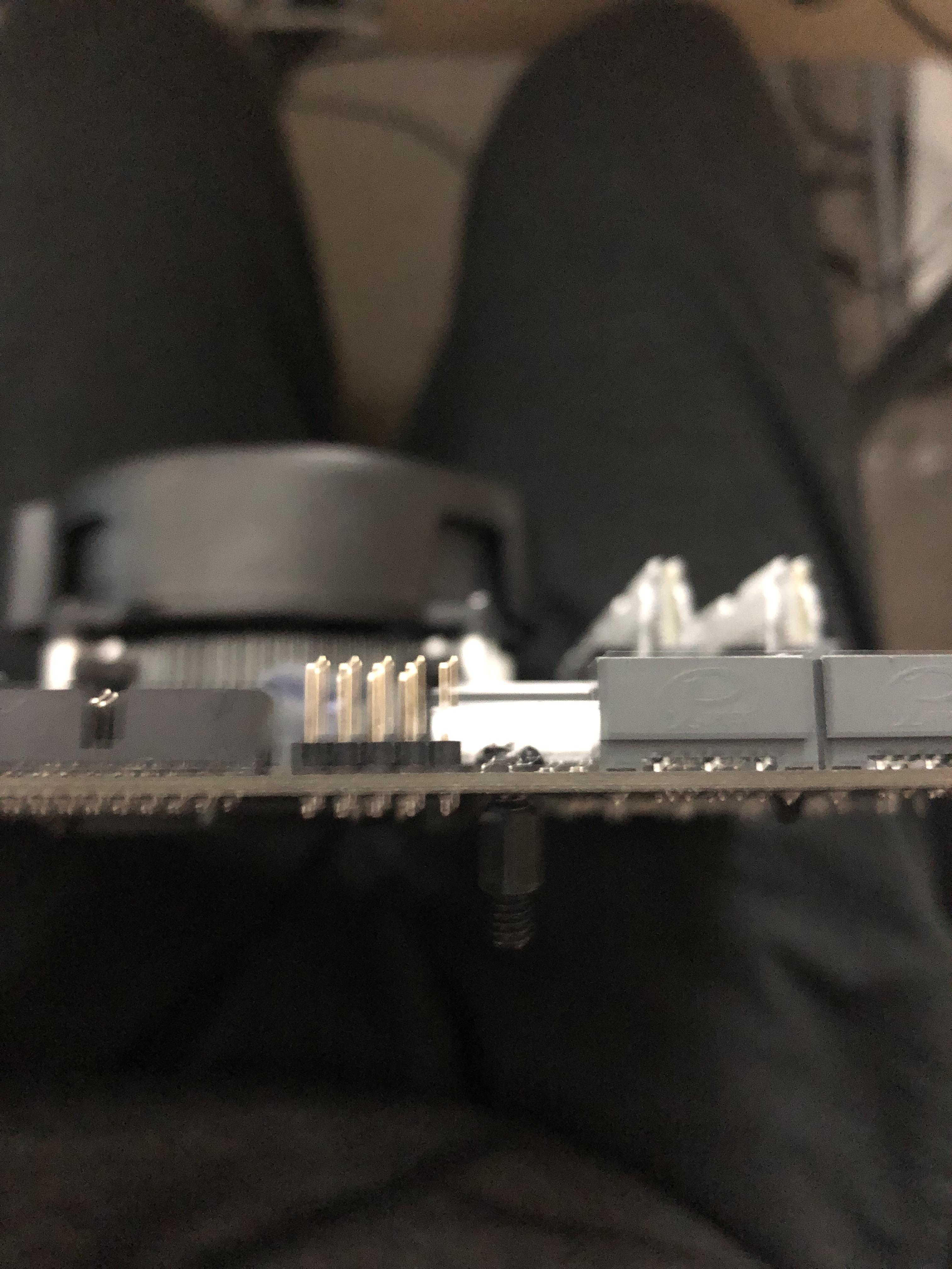 Motherboard standoff stuck to screw and refuses to budge. Any fixes