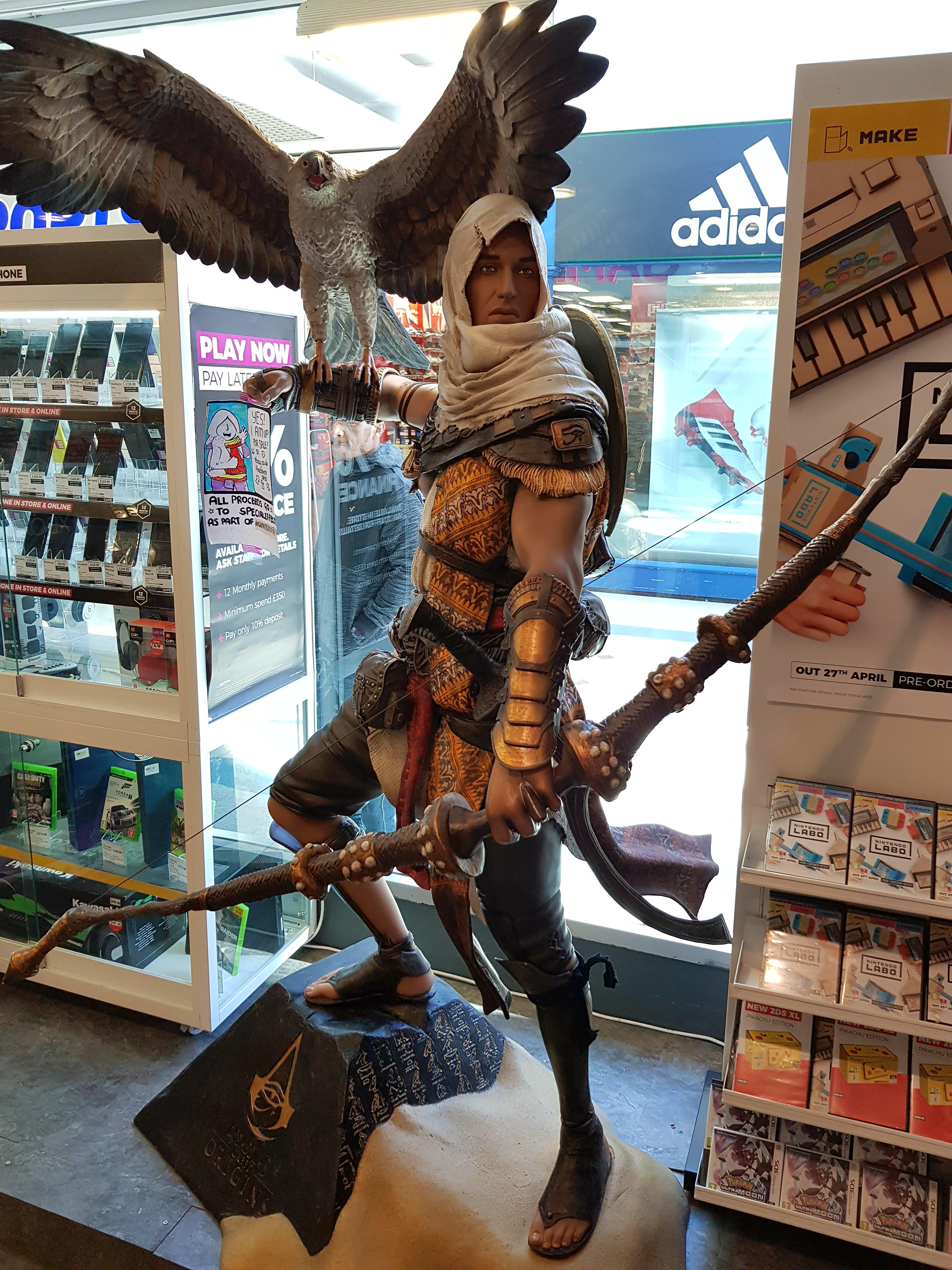 Found this lifesized Bayek and Senu statue in a game store near me