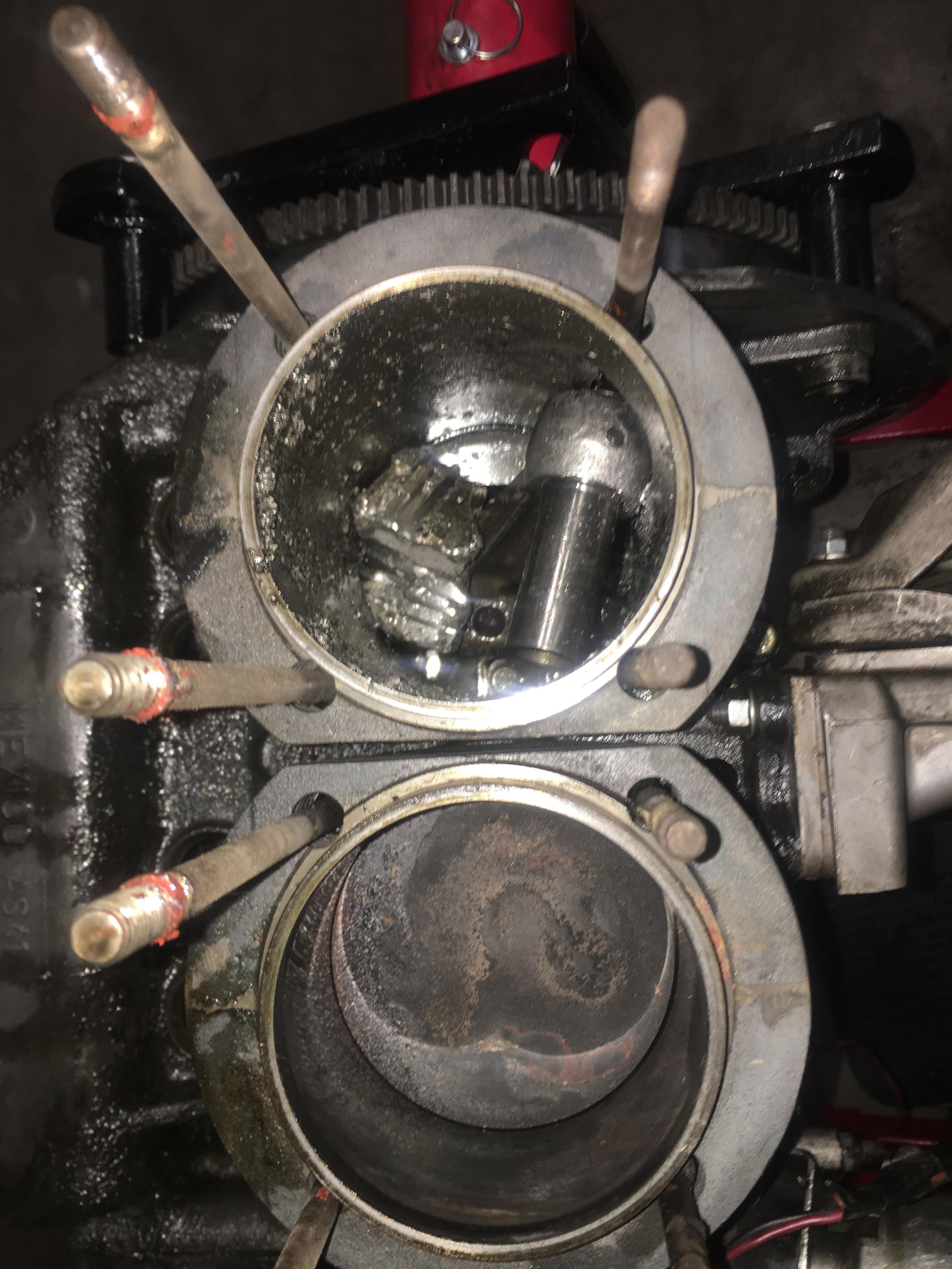 Bottom cylinder is normal. Top cylinder experienced major detonation