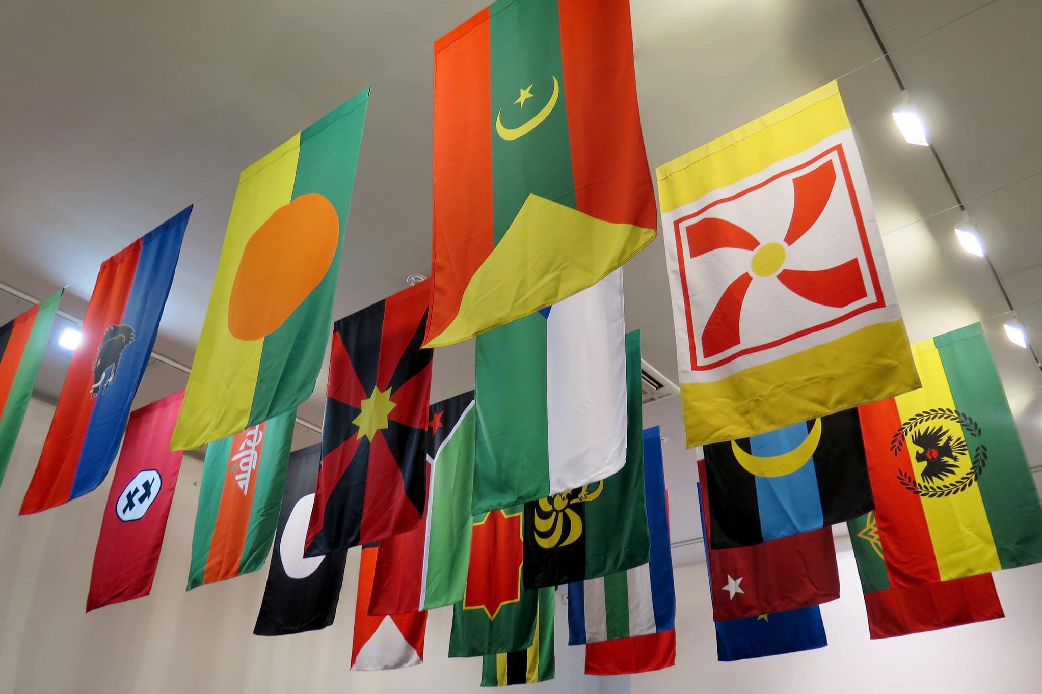 Flags displayed as part of an exhibit at Bemis Center For Contemporary