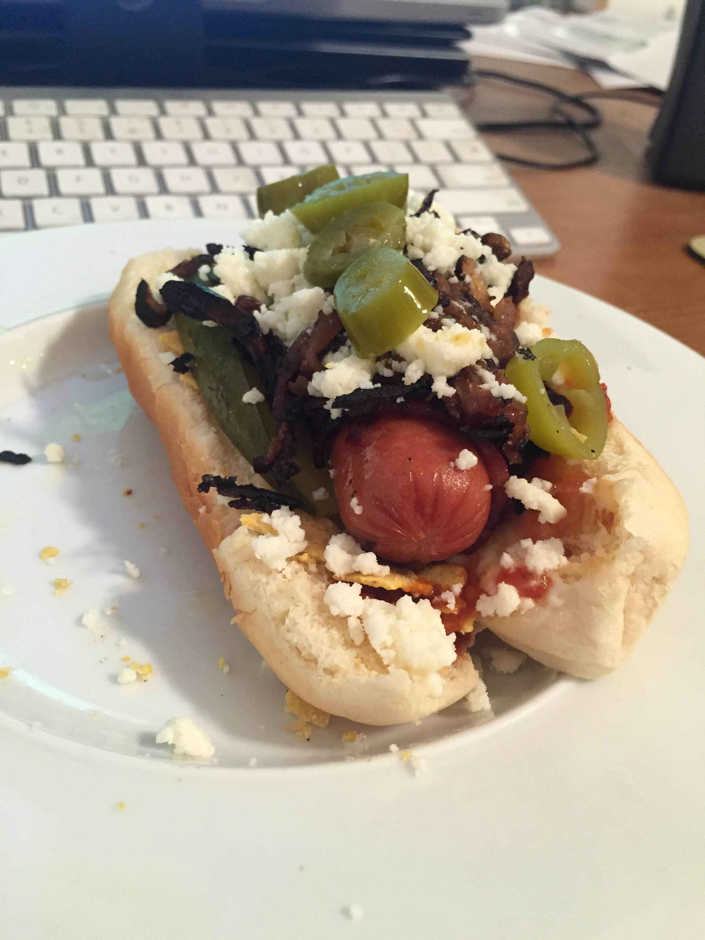 Hot dog w/ crispy red onion, Tapatio, mayo, crumbled tortilla, cotija cheese, jalapeno & a