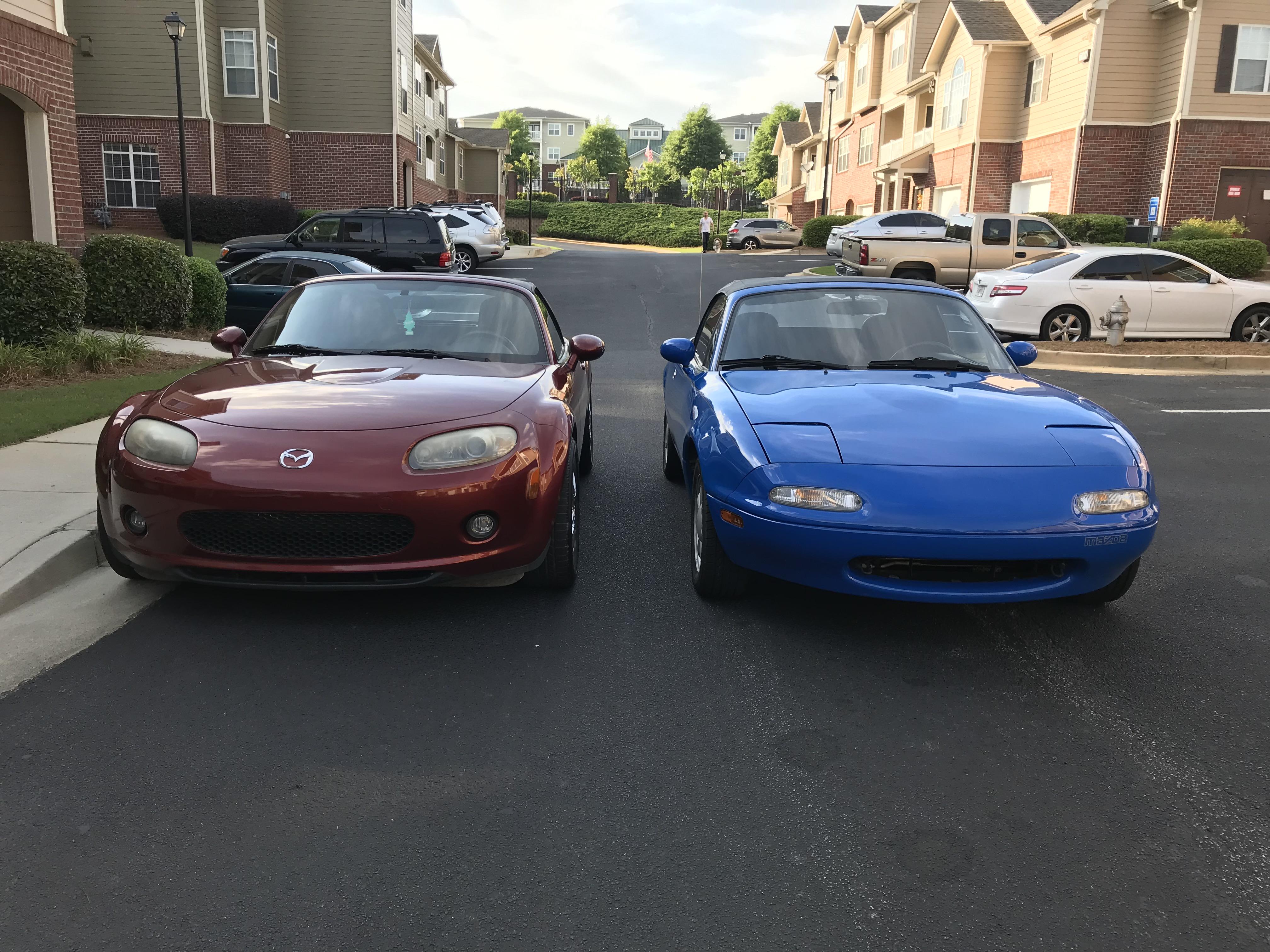 my two miatas parking side by side, a 90 NA and a 07 NC r/Miata