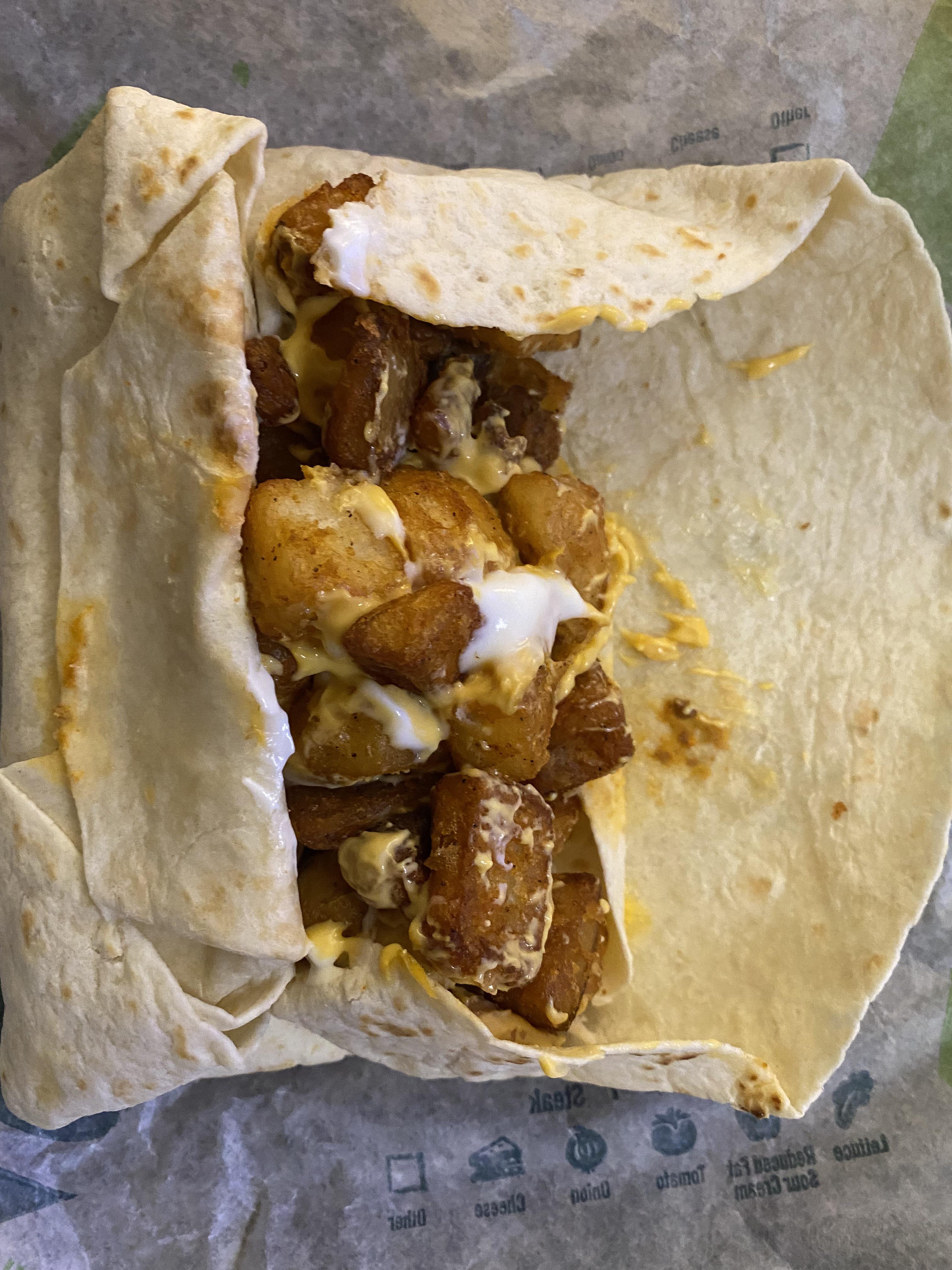 5 layer burrito with cheesy fiesta potatoes inside 🤤 r/tacobell