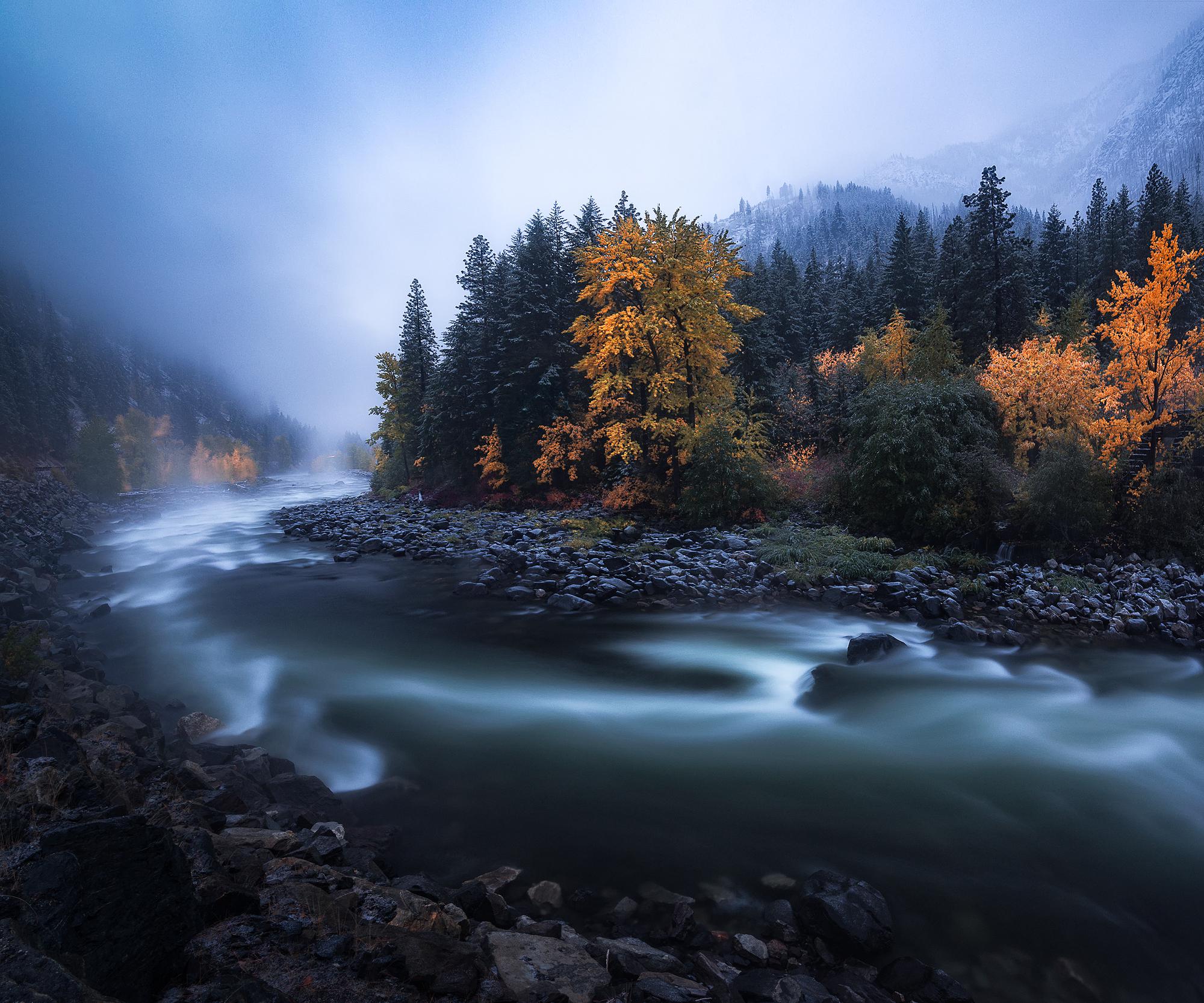 Fall colors at dusk during the start of a snowstorm in Leavenworth
