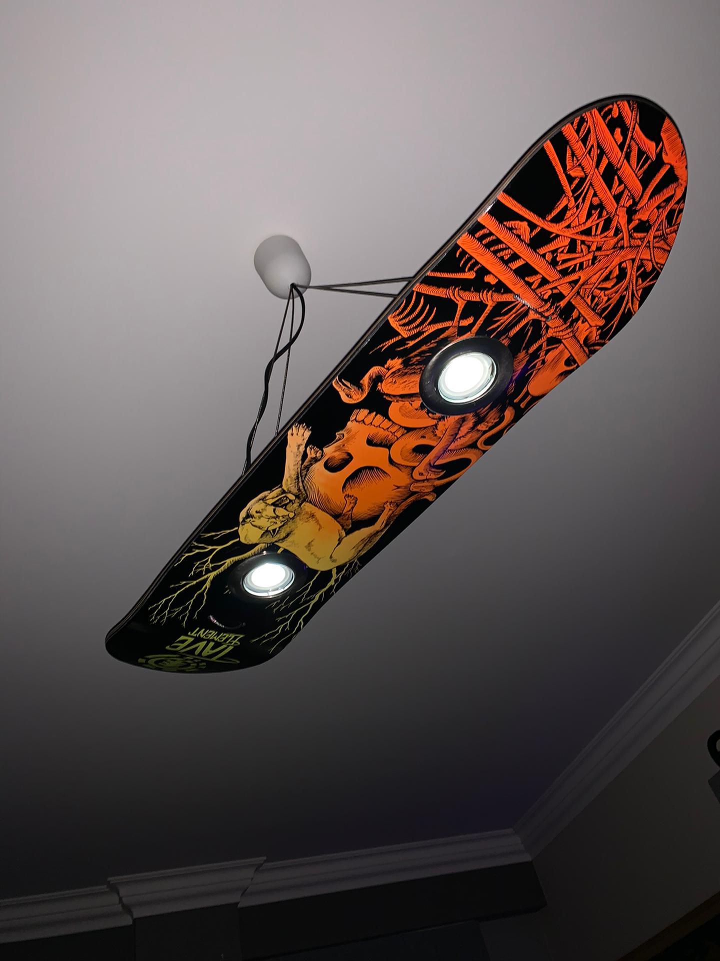 I see your skateboard wall lamp, and raise you my ceiling skateboard
