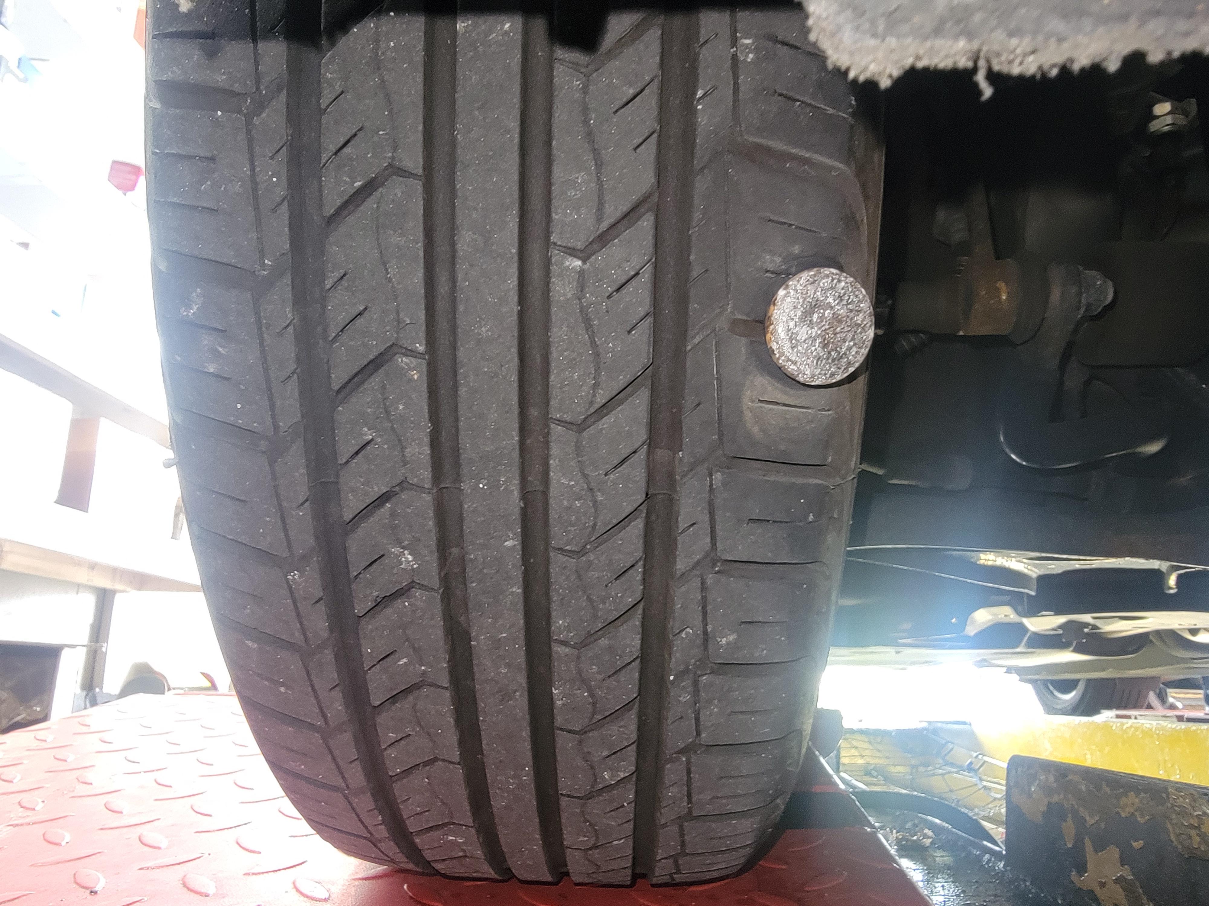 Customer says there is a weird tapping sound after tire rotation... r